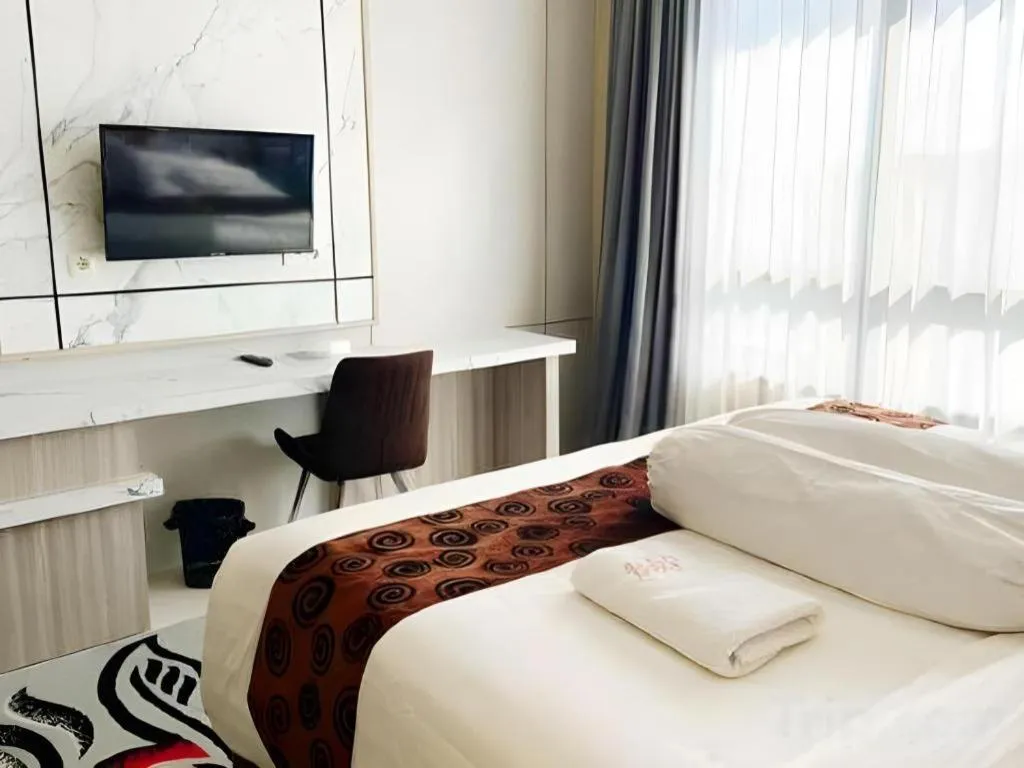 Bed in Sumbawa Grand Hotel