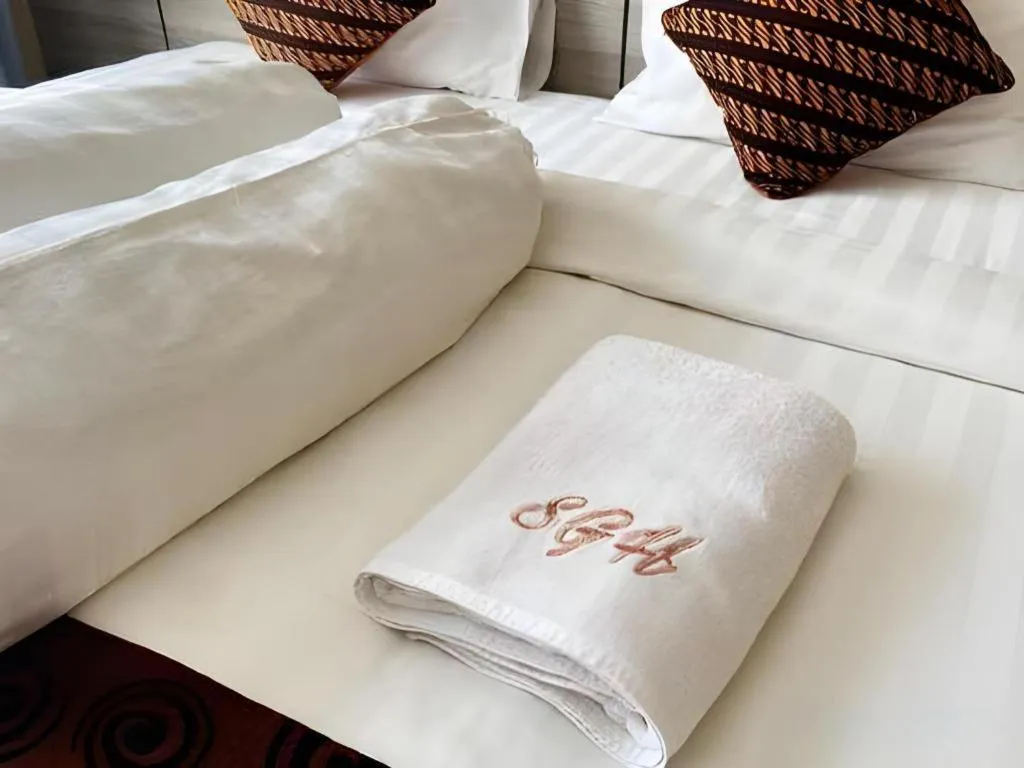 Bed in Sumbawa Grand Hotel