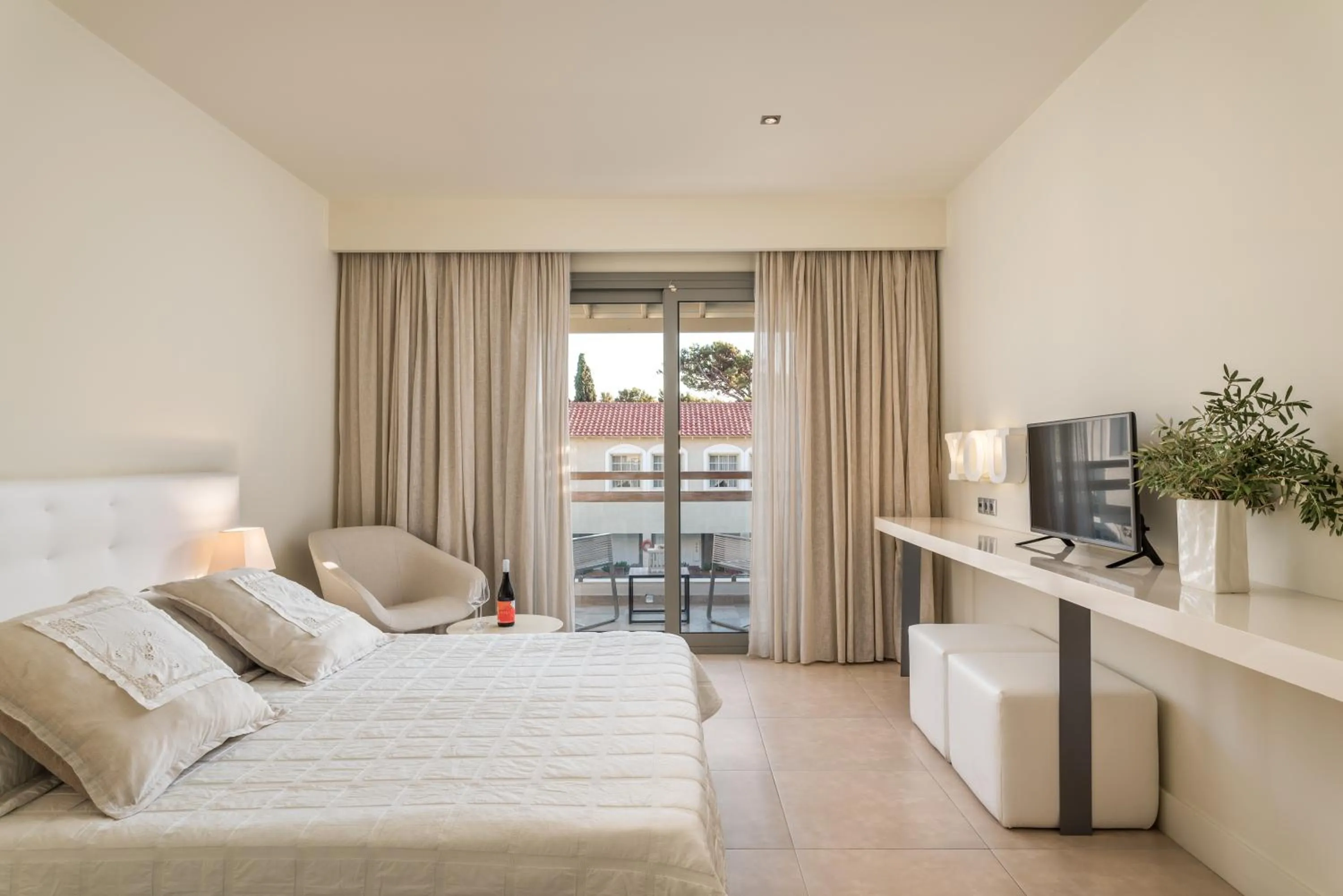 Bed in Ino Hotel & Suites