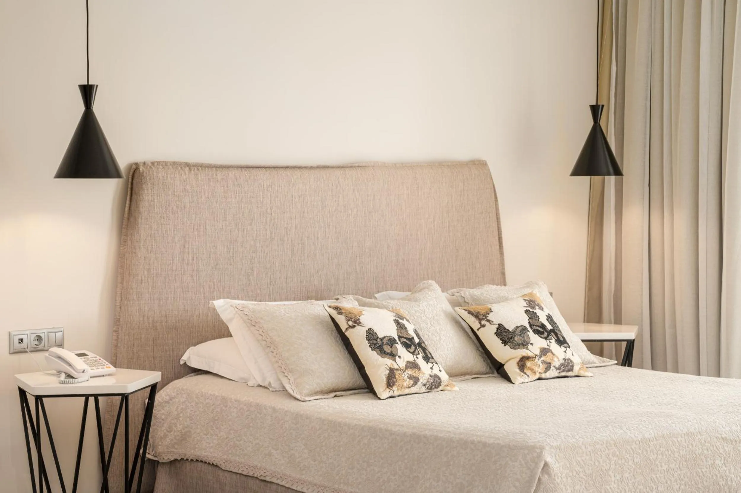 Bed in Ino Hotel & Suites