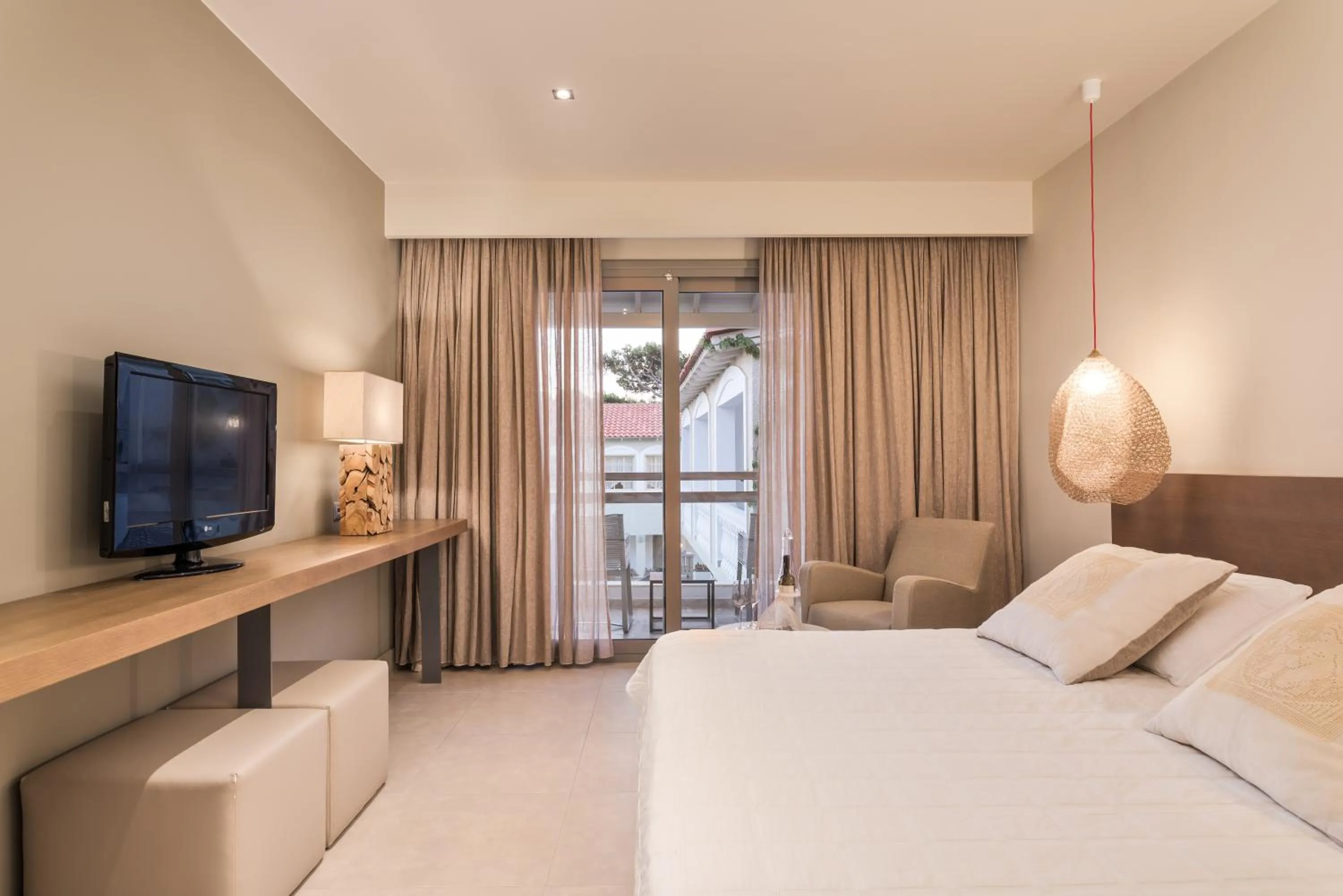 Bed in Ino Hotel & Suites