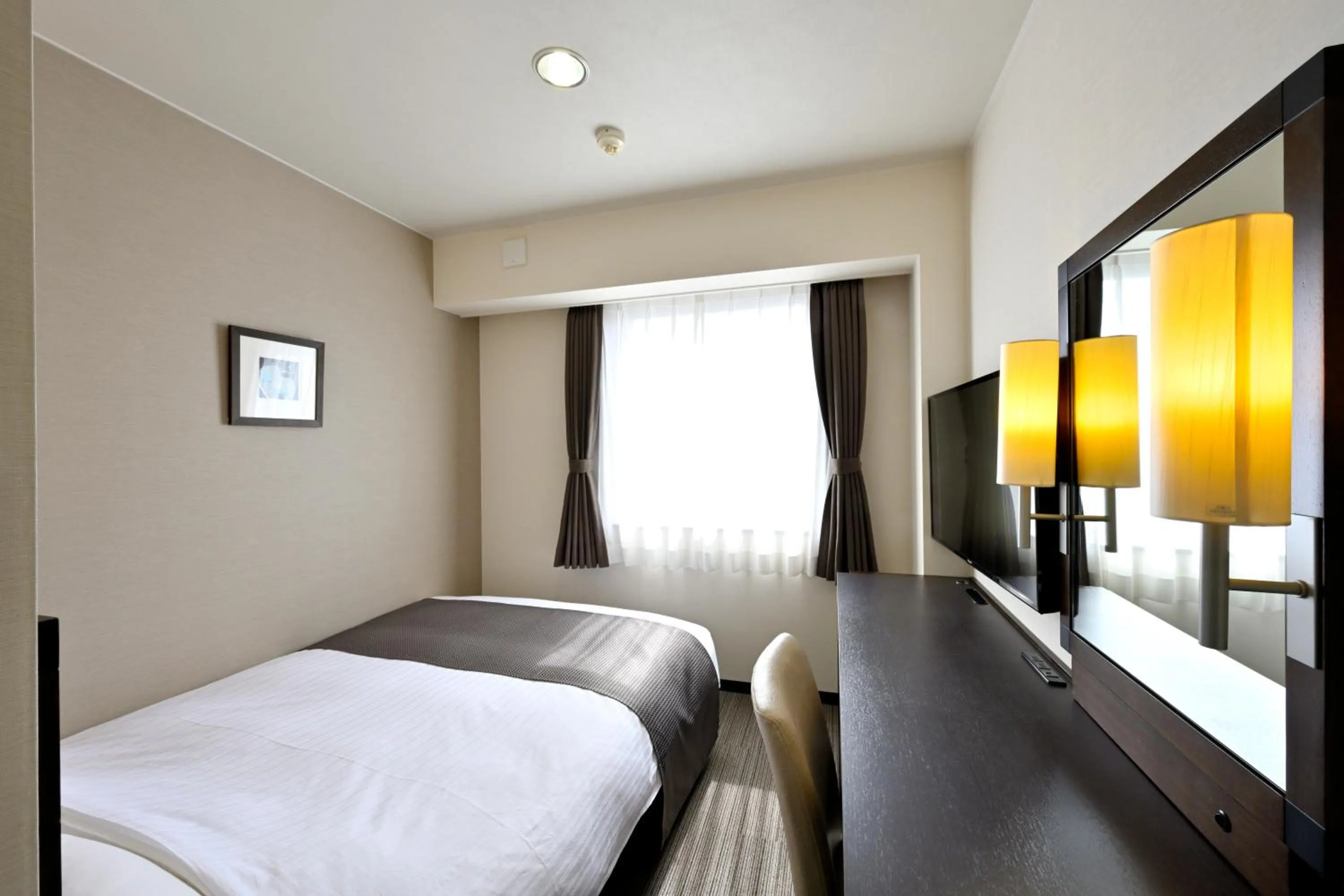 Bed in Saijo Urban Hotel