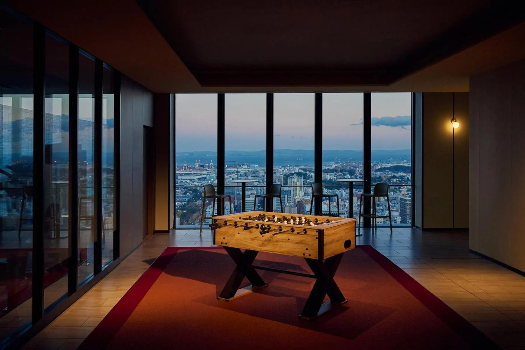 Communal lounge/ TV room in OMO5 Yokohama Bashamichi by Hoshino Resorts