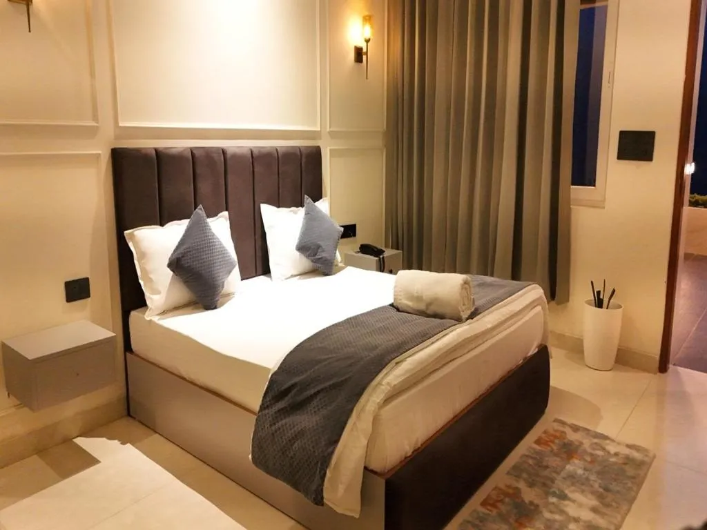 Bed in Yashasvi Himalayan Resort