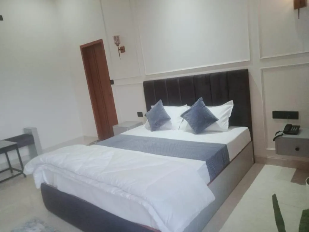 Bed in Yashasvi Himalayan Resort