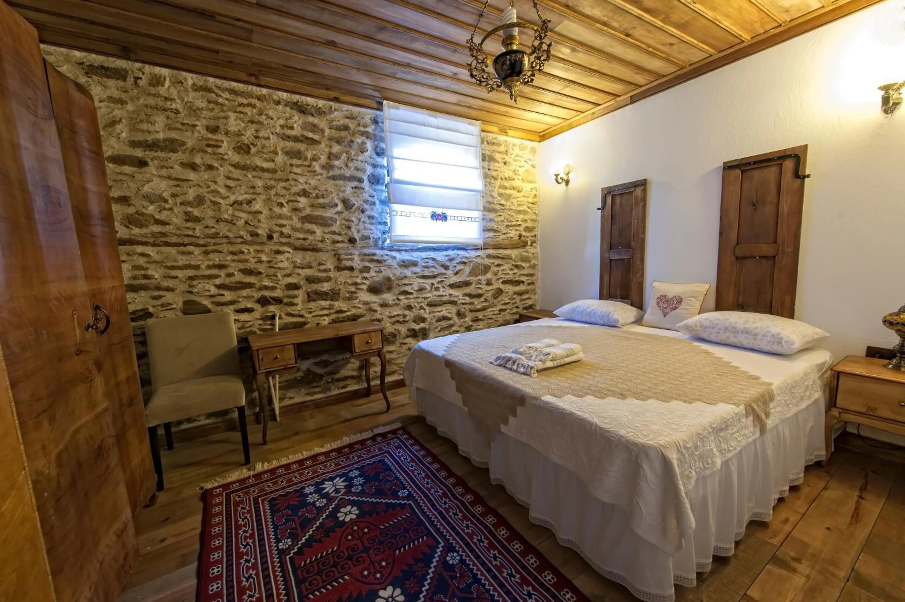 Photo of the whole room in Birgi Hotel Saliha Hanim Tas Konak