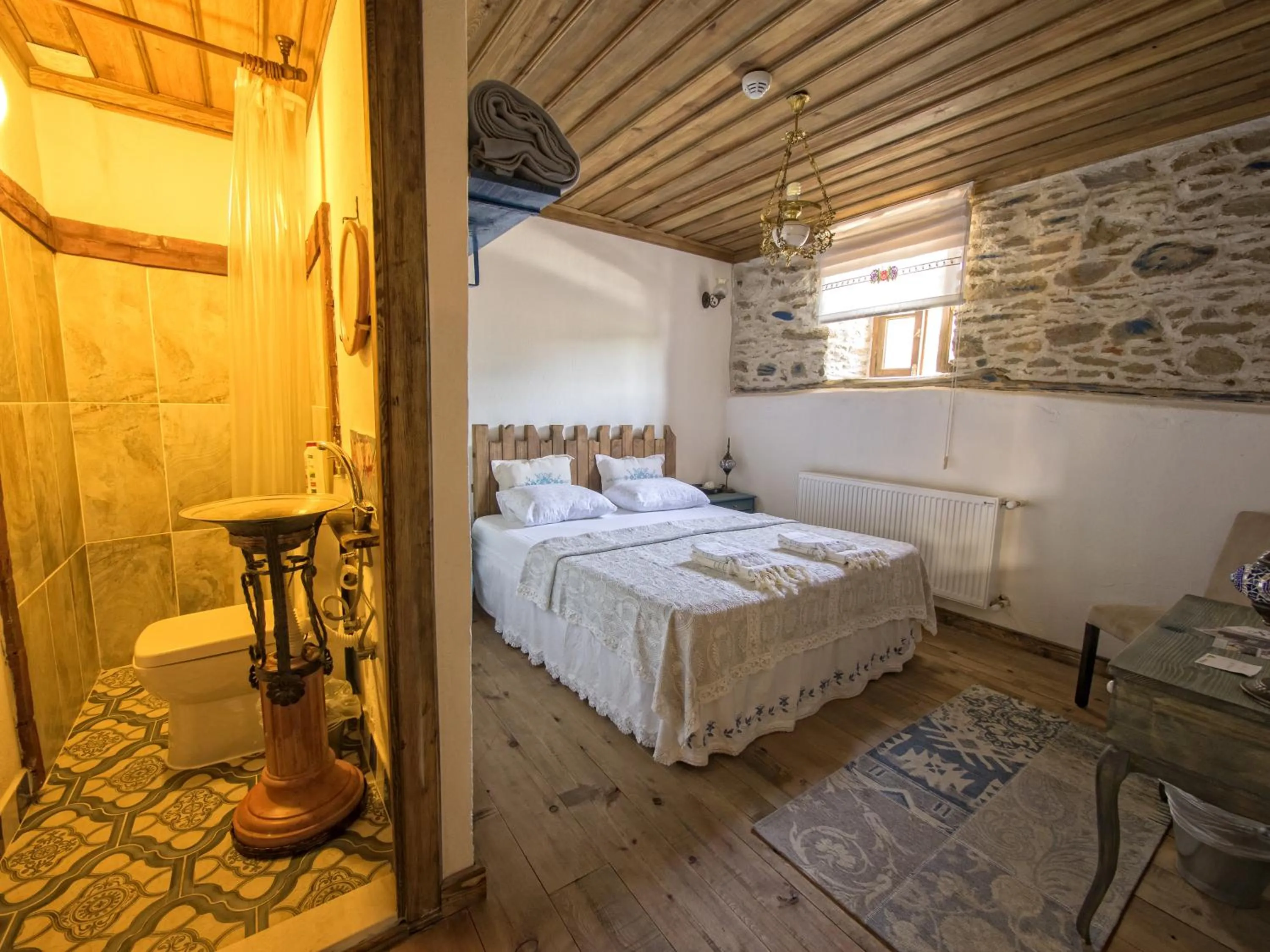 Photo of the whole room in Birgi Hotel Saliha Hanim Tas Konak