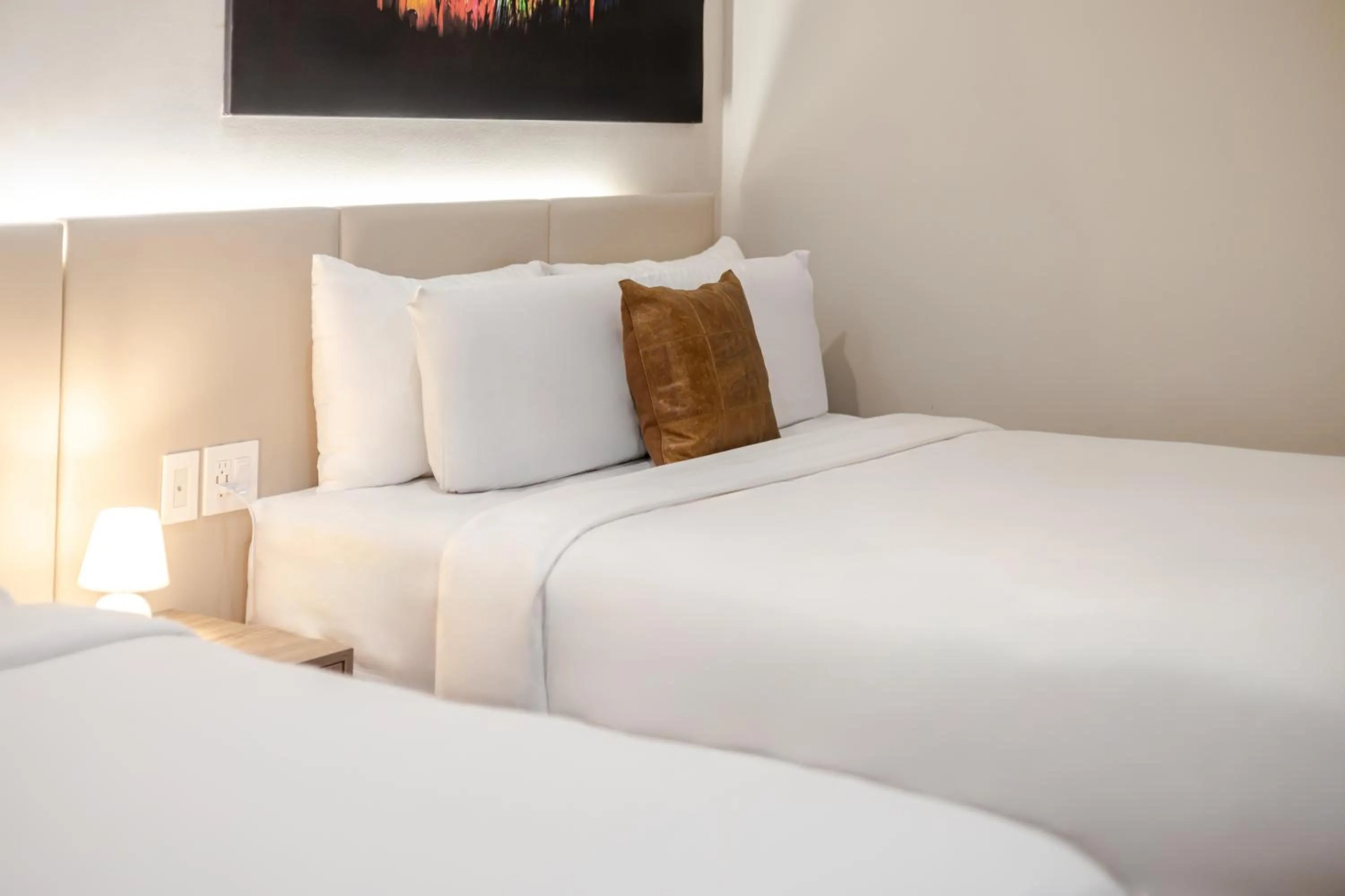 Bed in Olympia Hotel by Lodgo