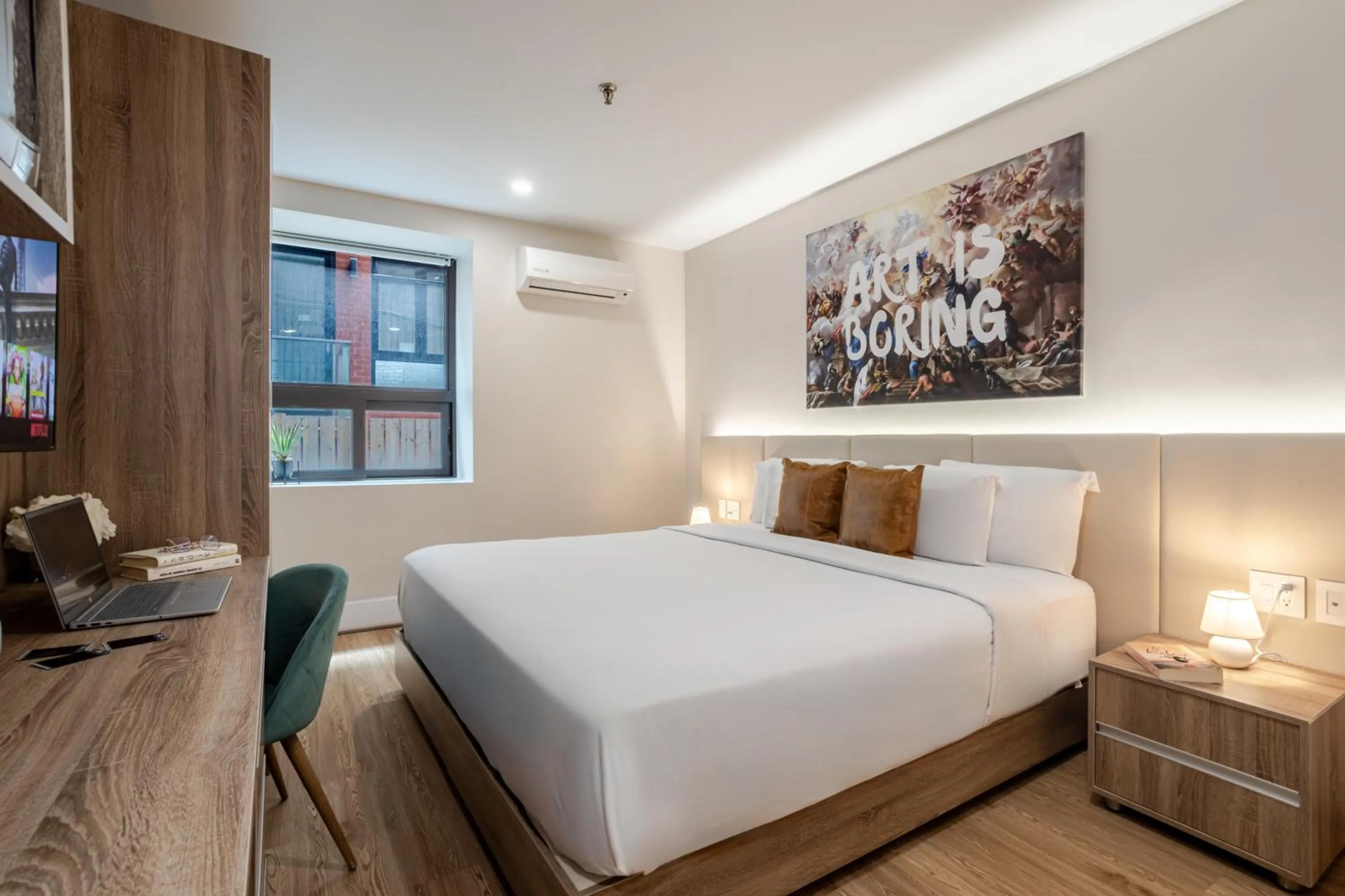 Bed in Olympia Hotel by Lodgo