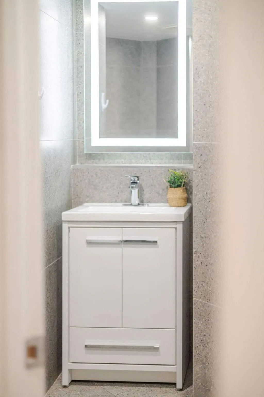 Bathroom in Olympia Hotel by Lodgo