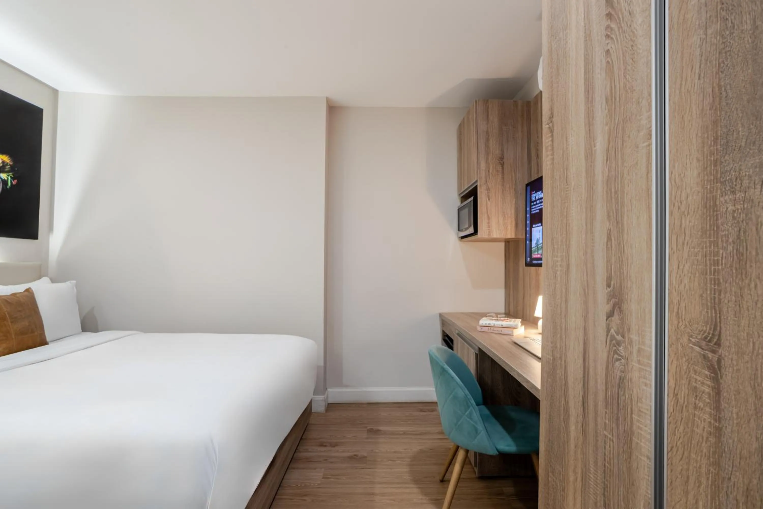 Bed in Olympia Hotel by Lodgo