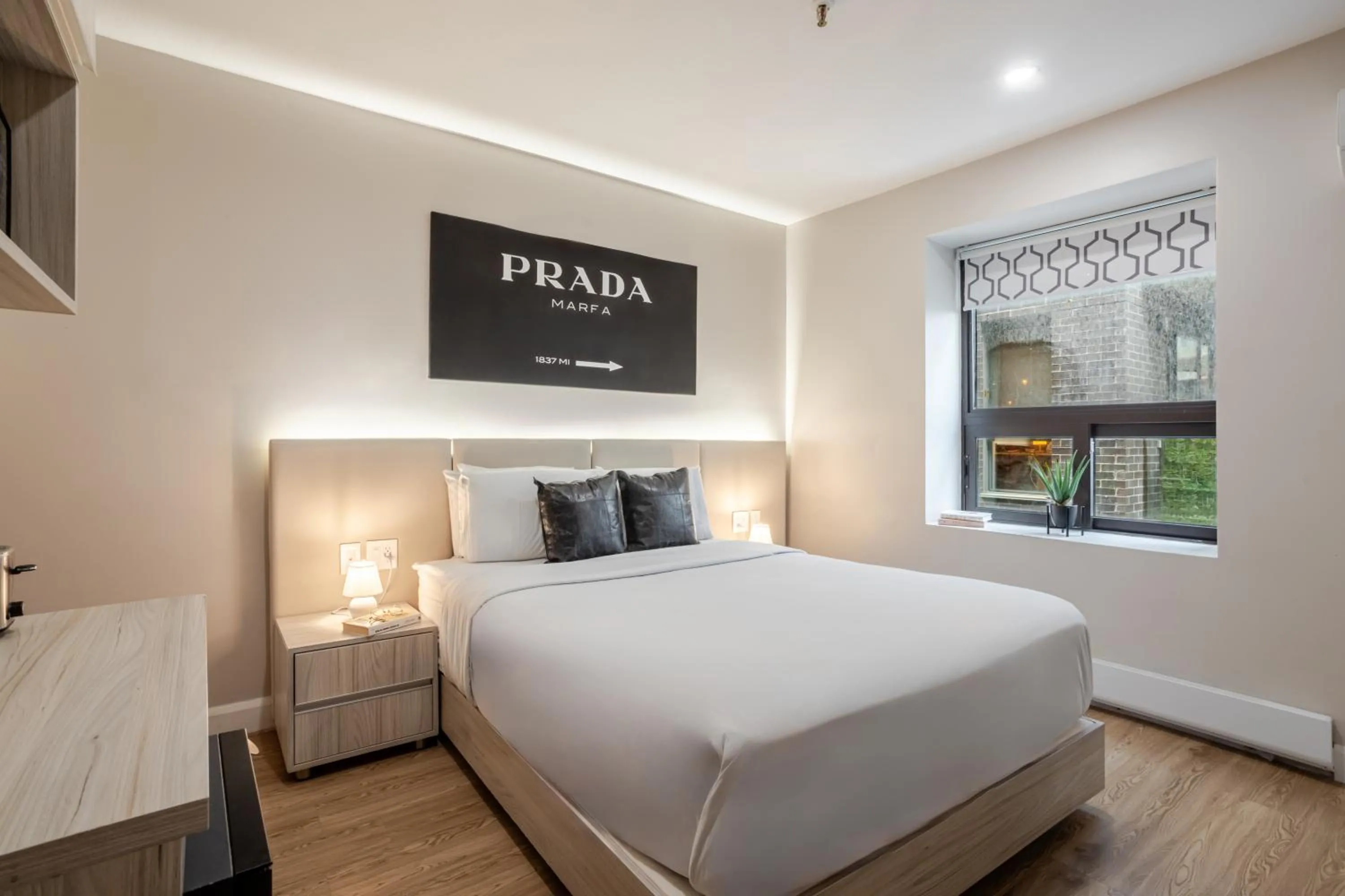 Bed in Olympia Hotel by Lodgo