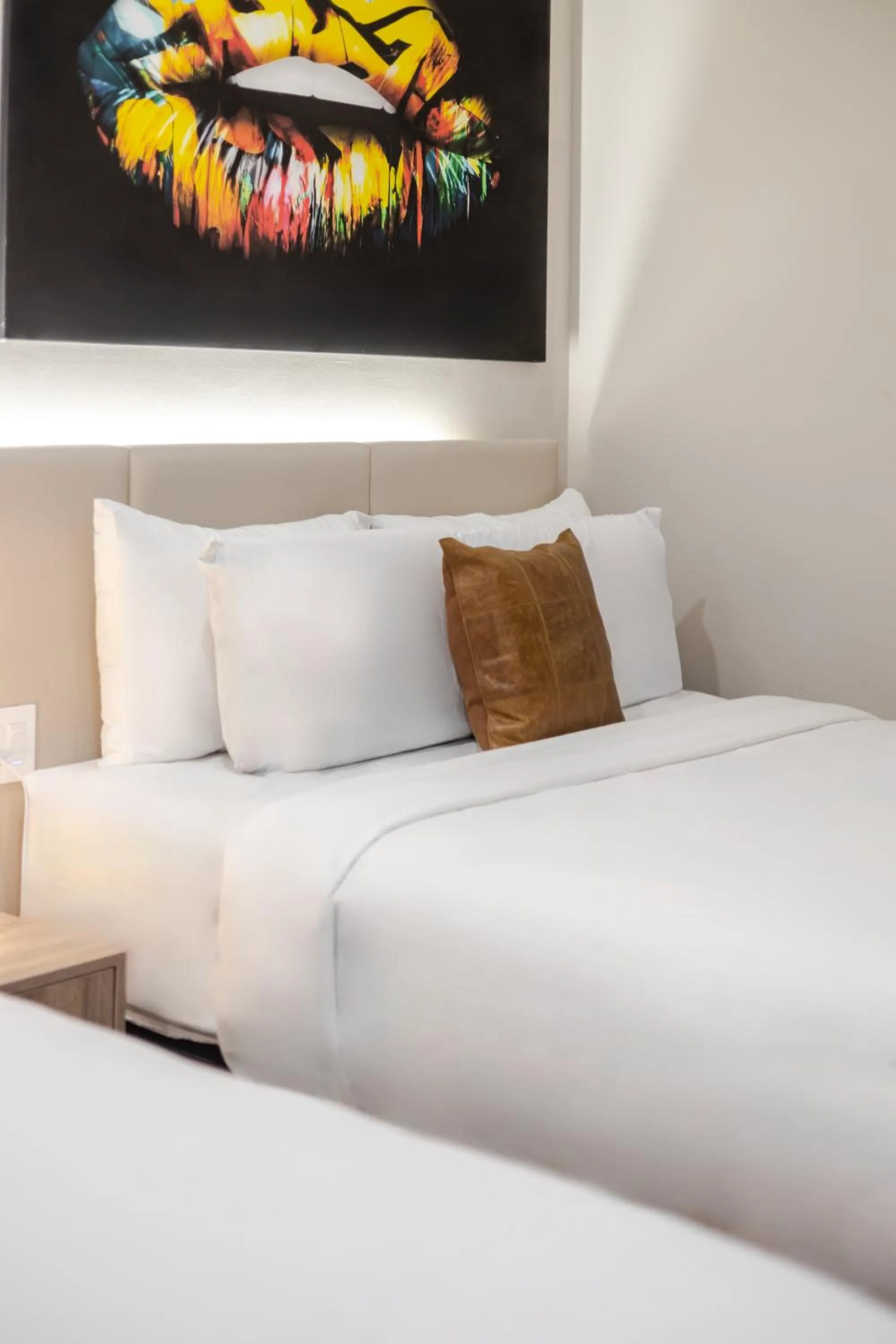 Bed in Olympia Hotel by Lodgo