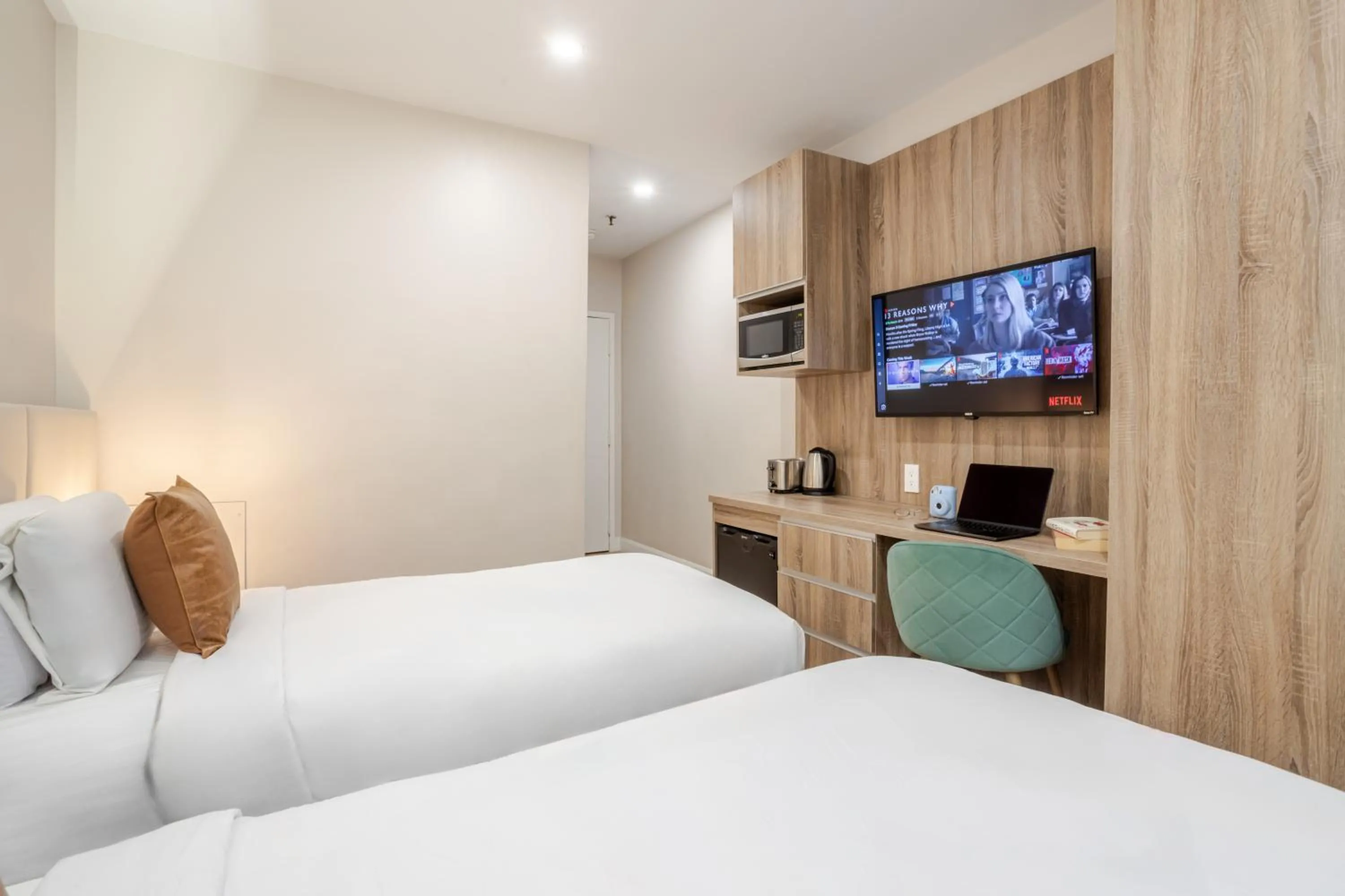 Bed in Olympia Hotel by Lodgo