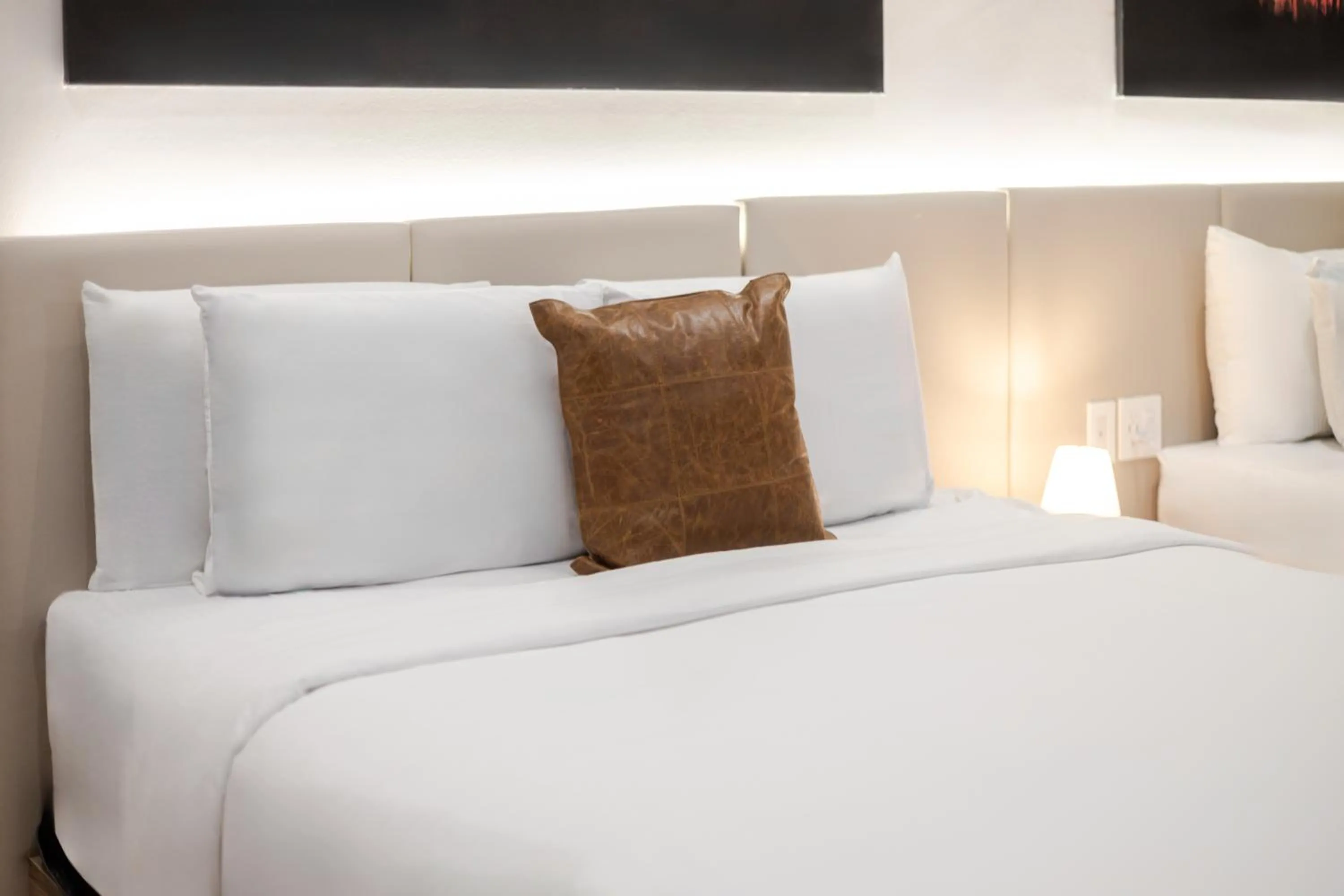 Bed in Olympia Hotel by Lodgo