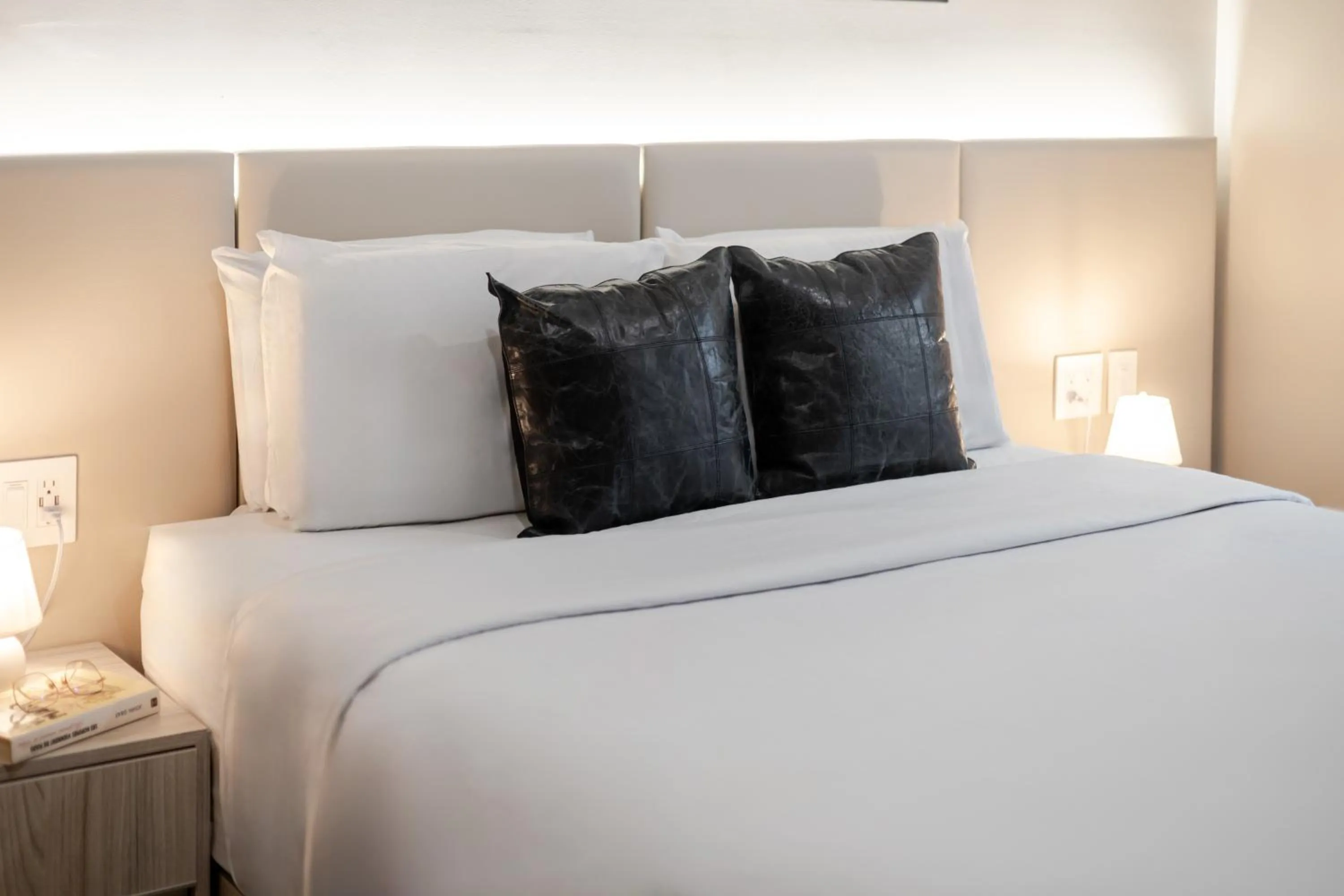 Bed in Olympia Hotel by Lodgo