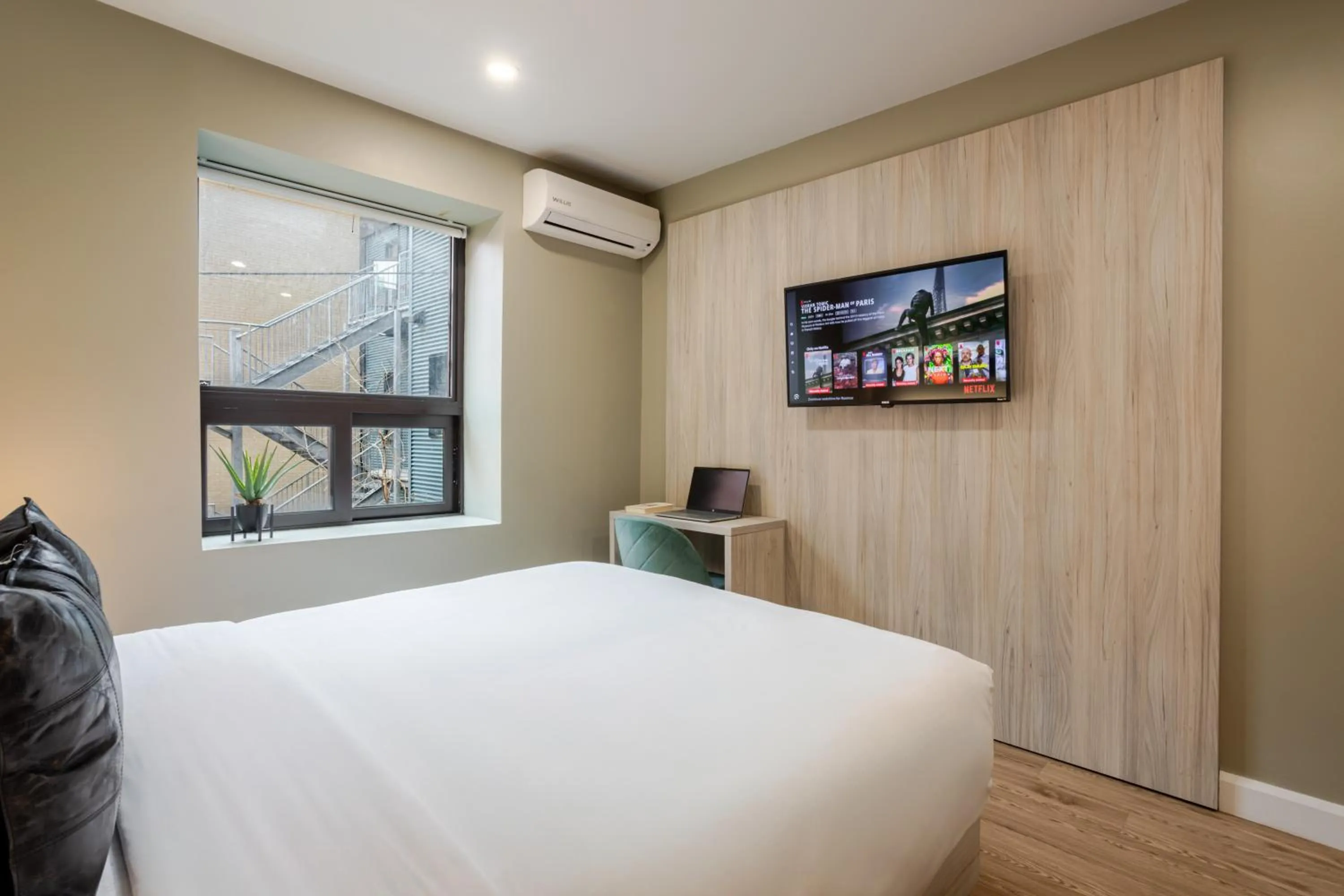 Bed in Olympia Hotel by Lodgo