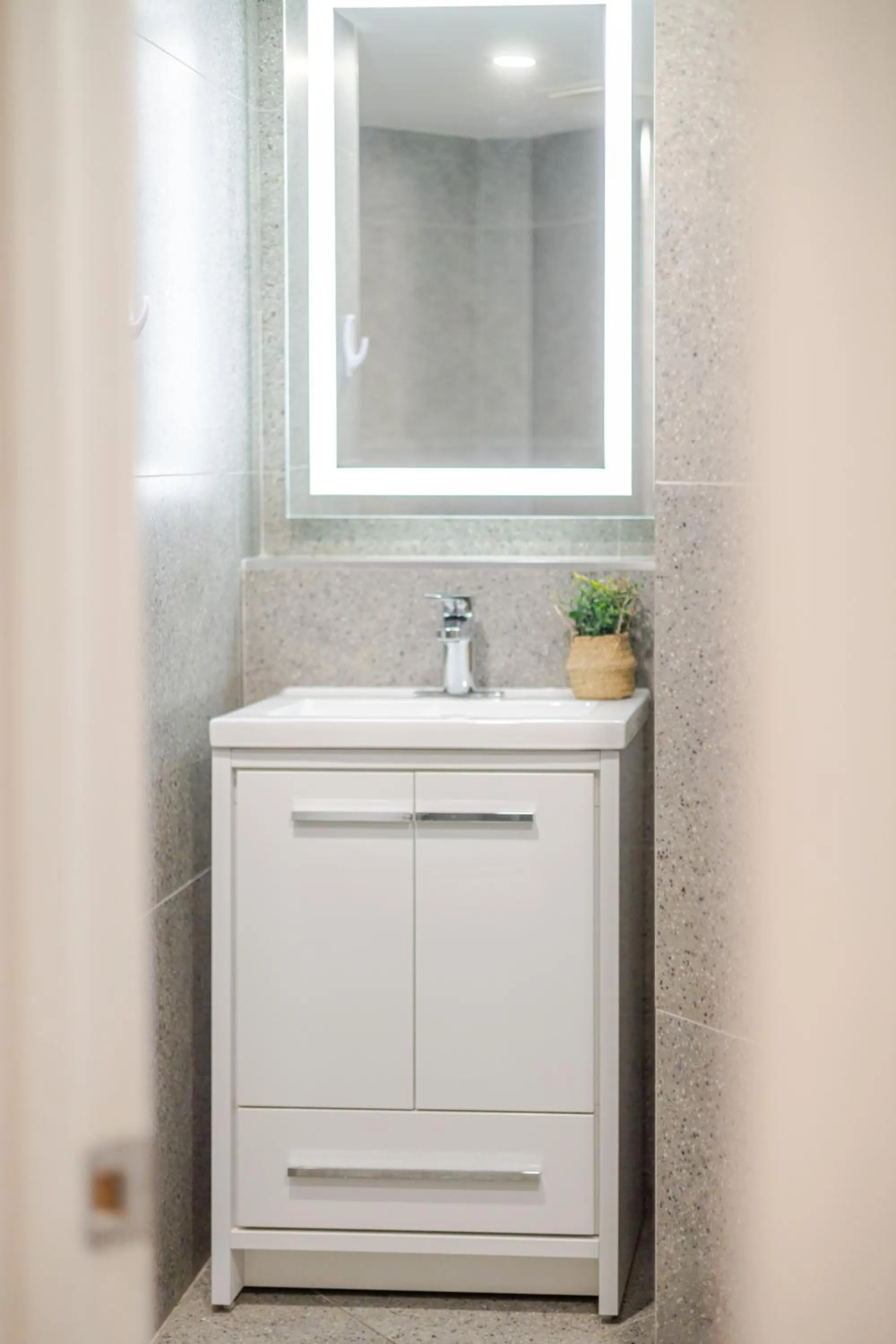 Bathroom in Olympia Hotel by Lodgo