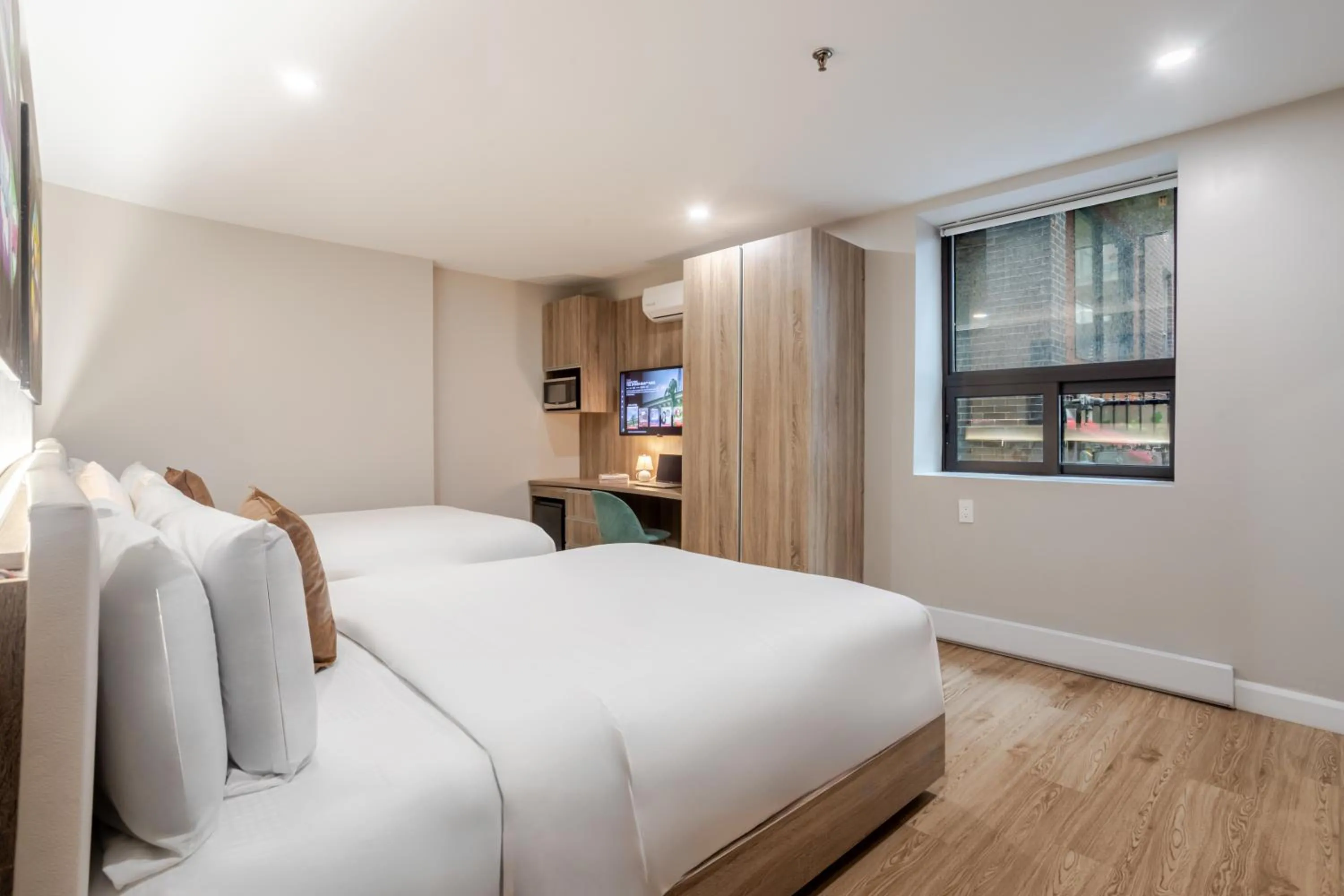 Bed in Olympia Hotel by Lodgo