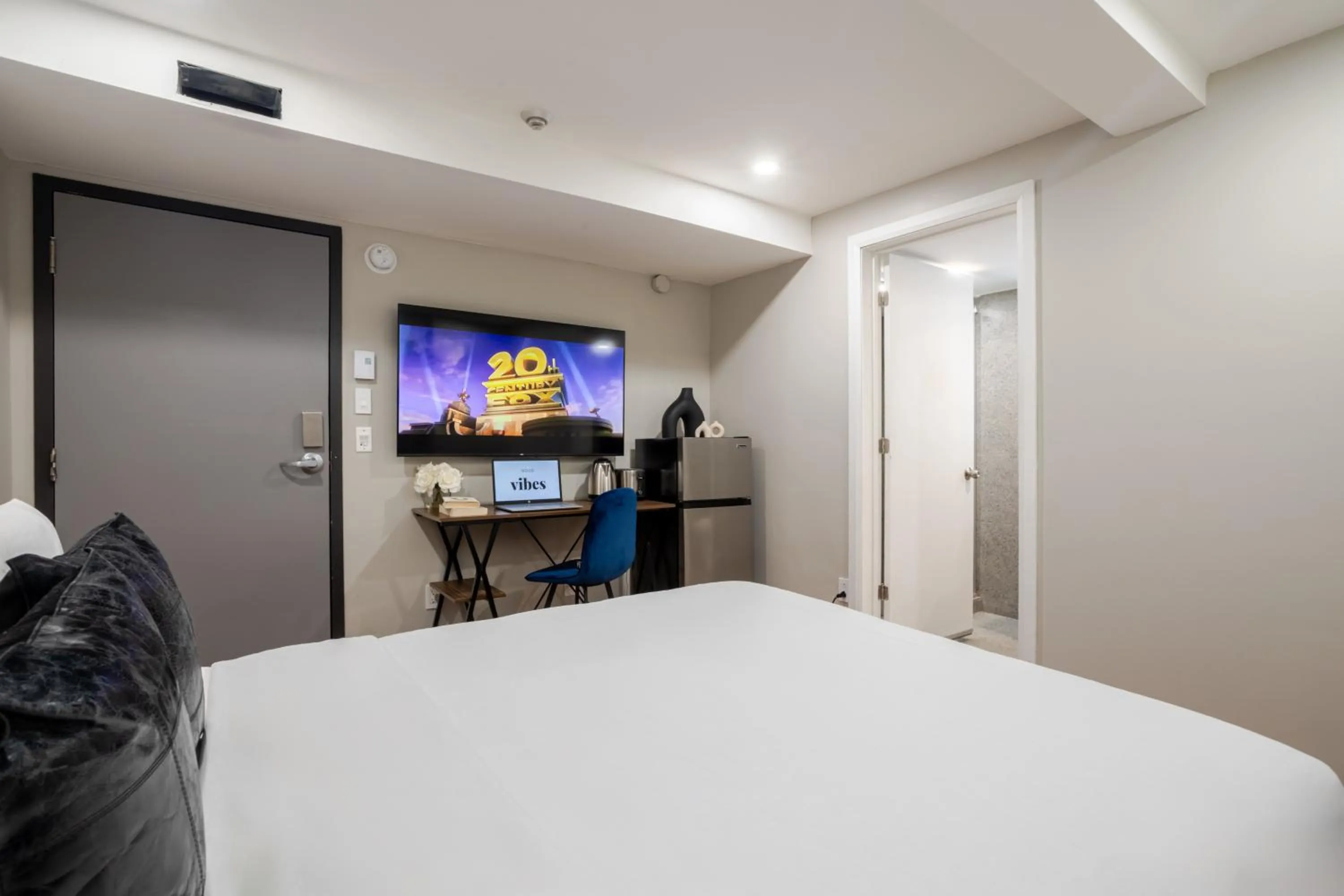 Bed in Olympia Hotel by Lodgo