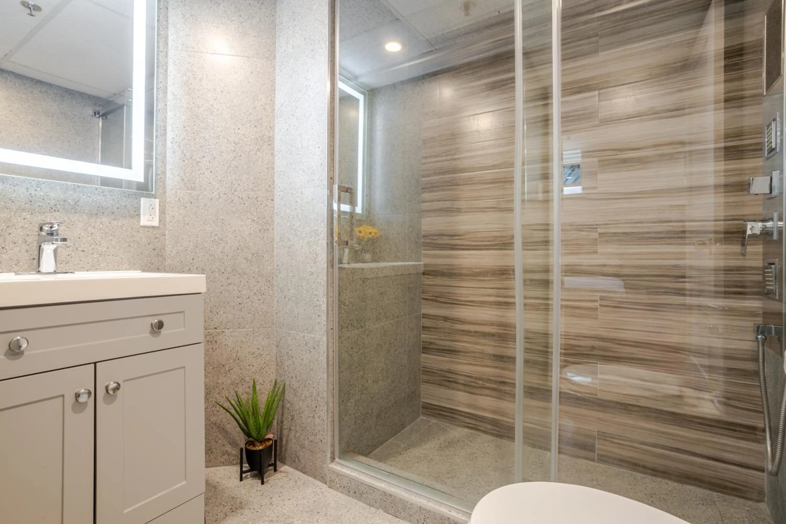 Shower in Olympia Hotel by Lodgo