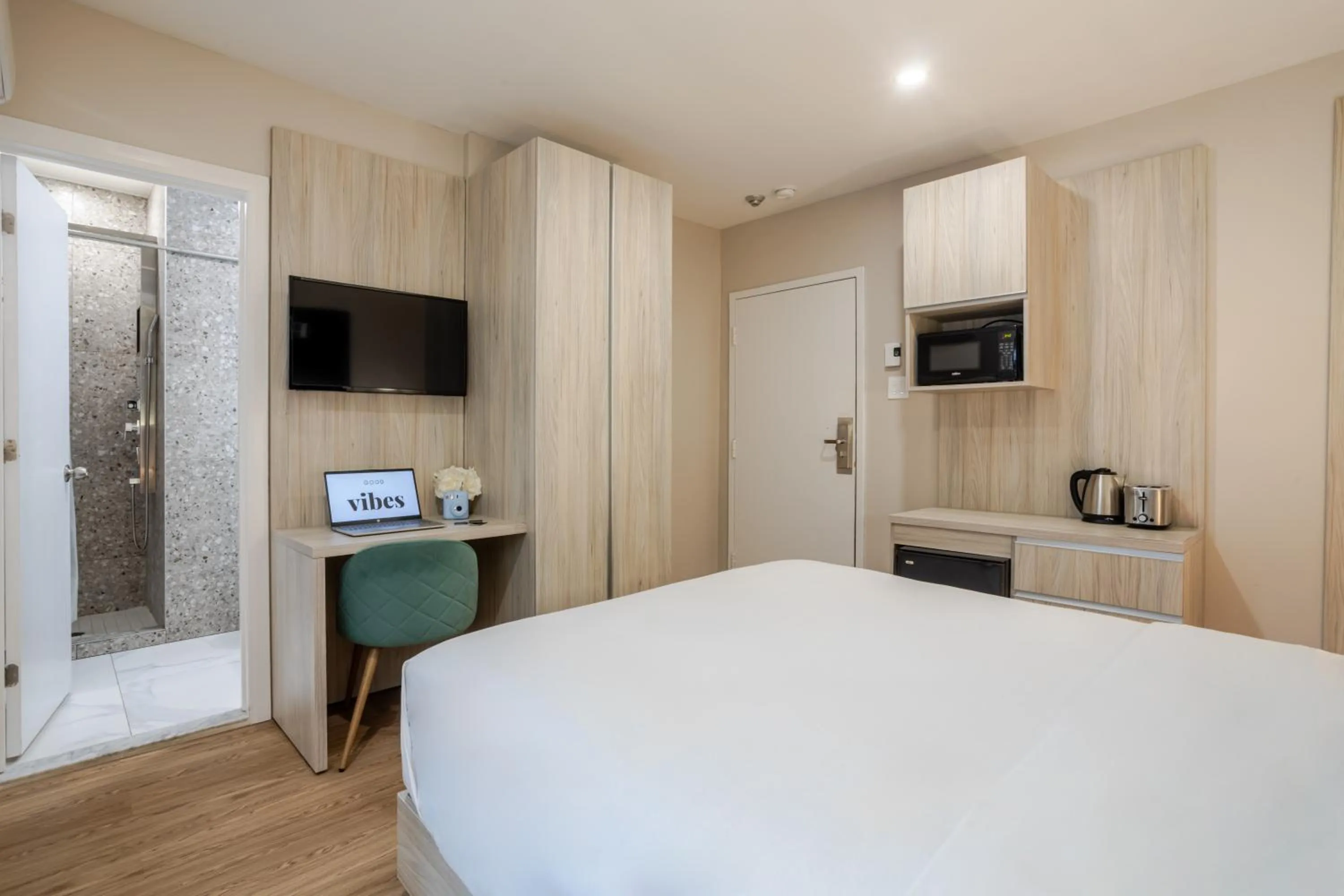 Bed in Olympia Hotel by Lodgo