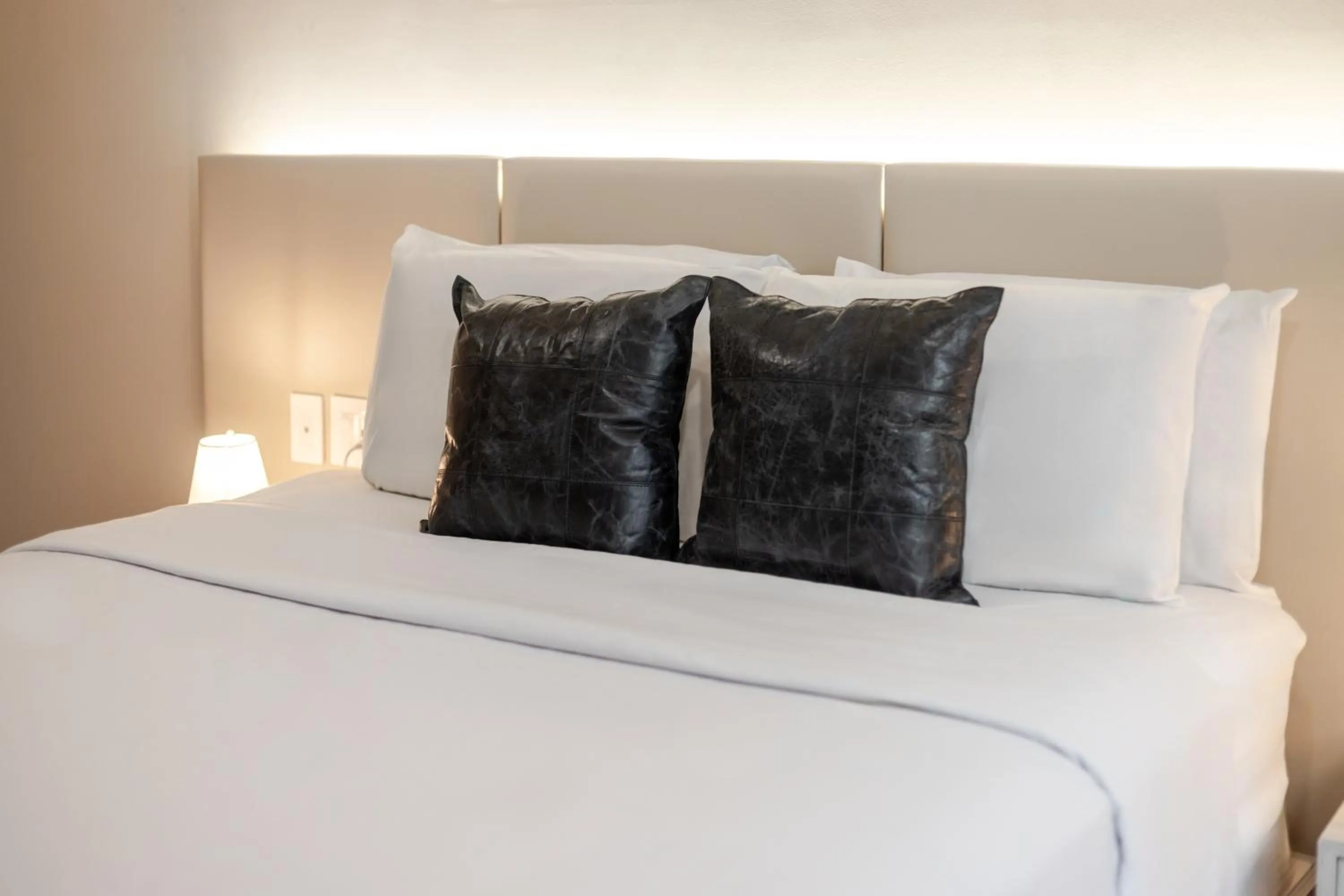 Bed in Olympia Hotel by Lodgo