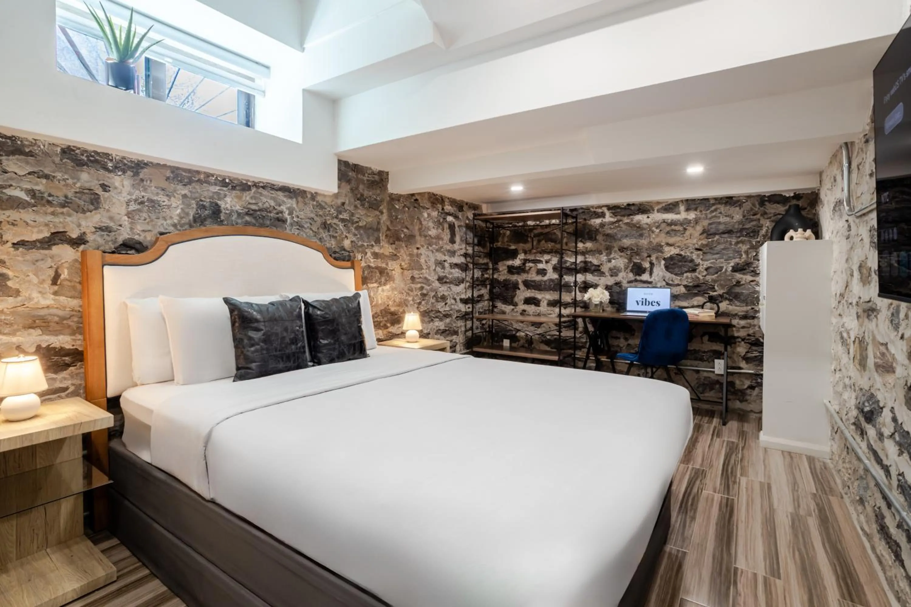 Bed in Olympia Hotel by Lodgo