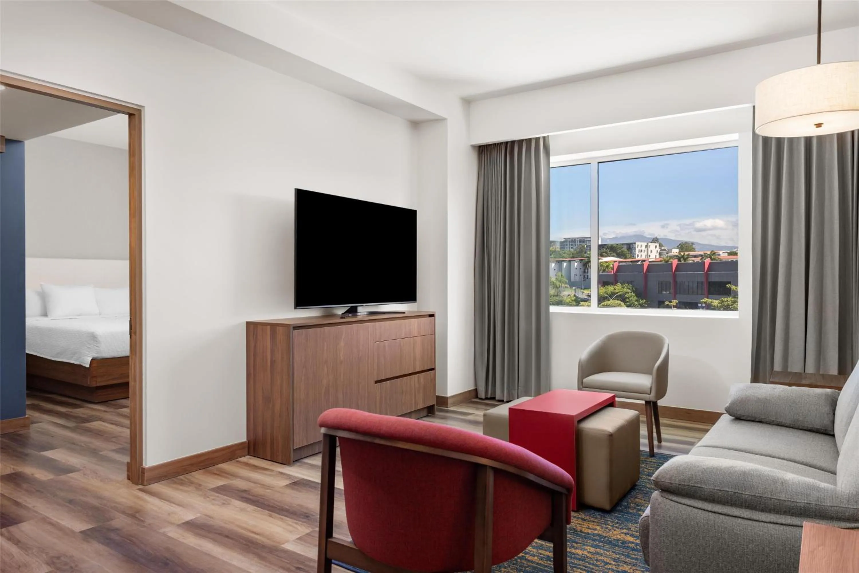 Living room, Bed in Homewood Suites By Hilton Cariari San Jose