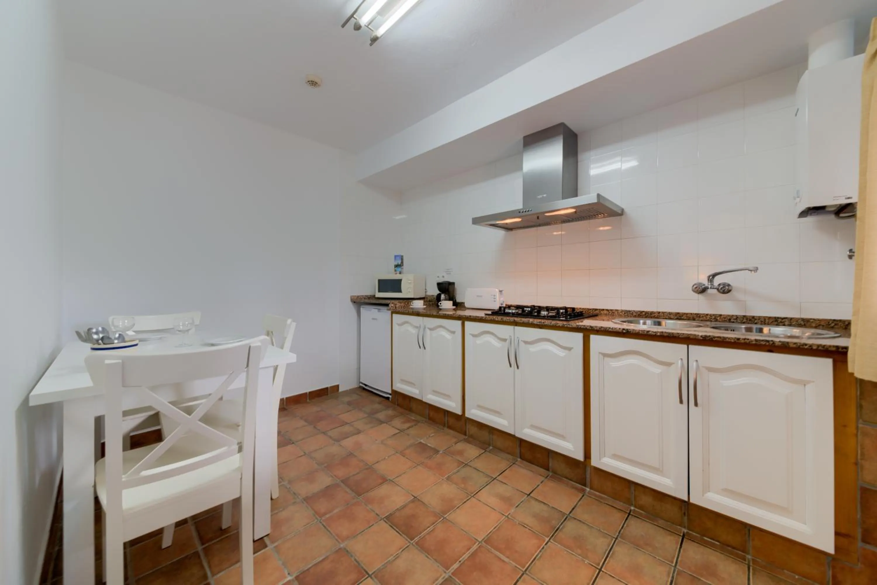 Kitchen or kitchenette in Dulce Nombre Hotel - Apartamentos