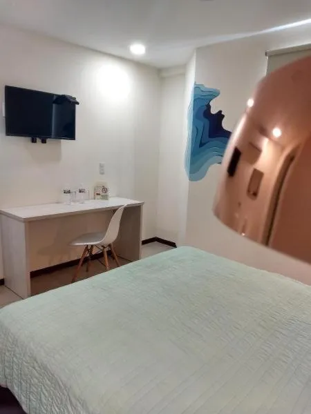 Bed in Angeles Suites & Hotel