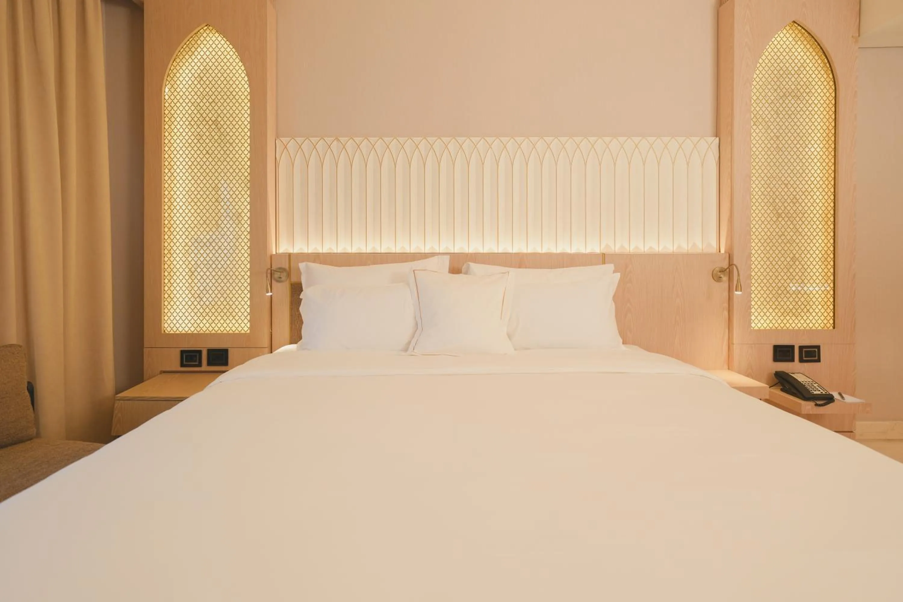 Bed in World Heart Hotel