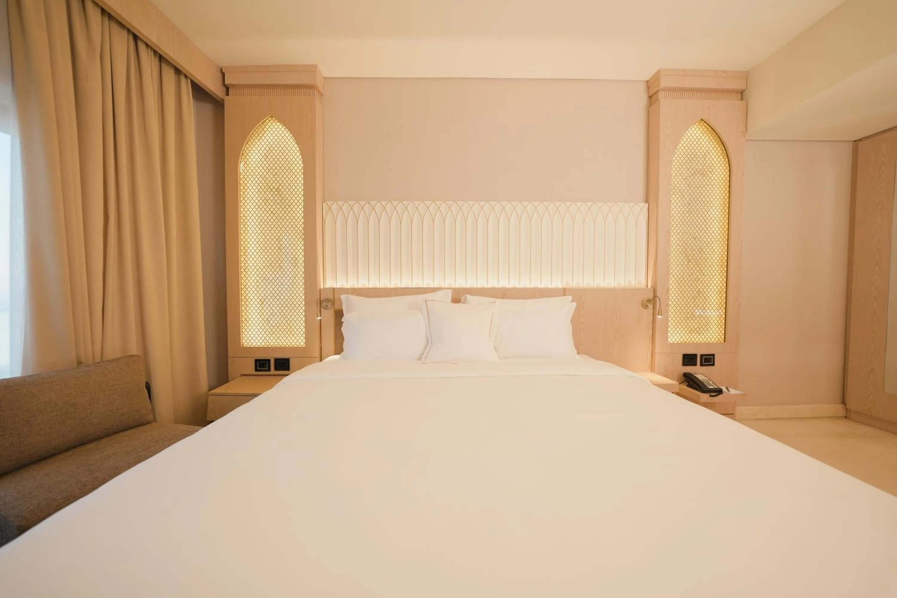 Bed in World Heart Hotel