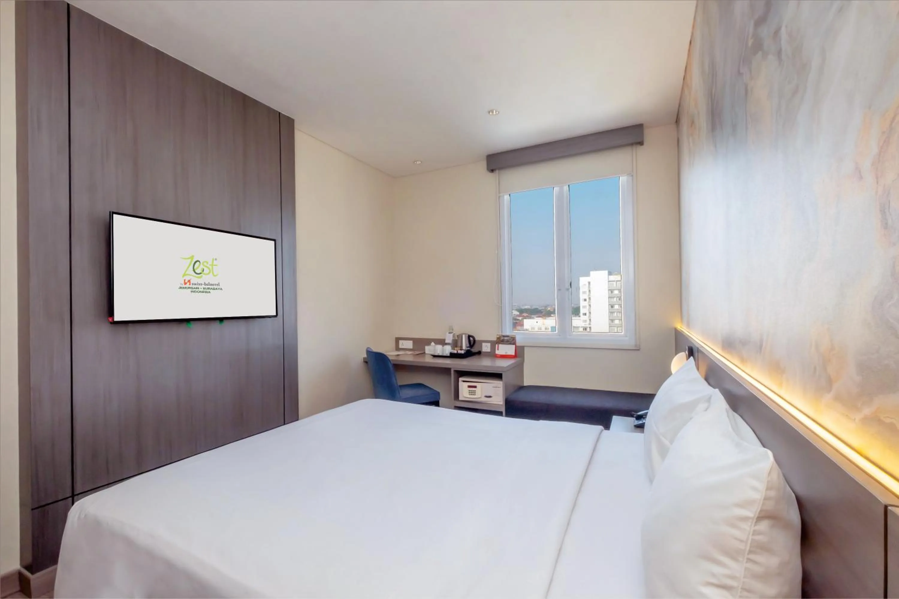 Bed in Zest Jemursari by Swiss-Belhotel International