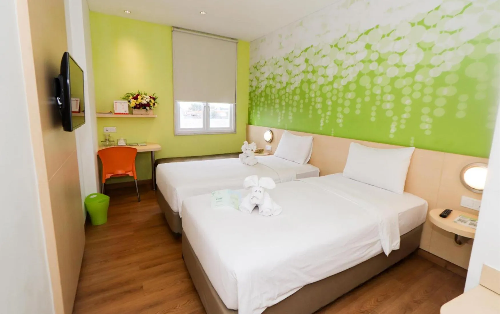 Bed in Zest Jemursari by Swiss-Belhotel International