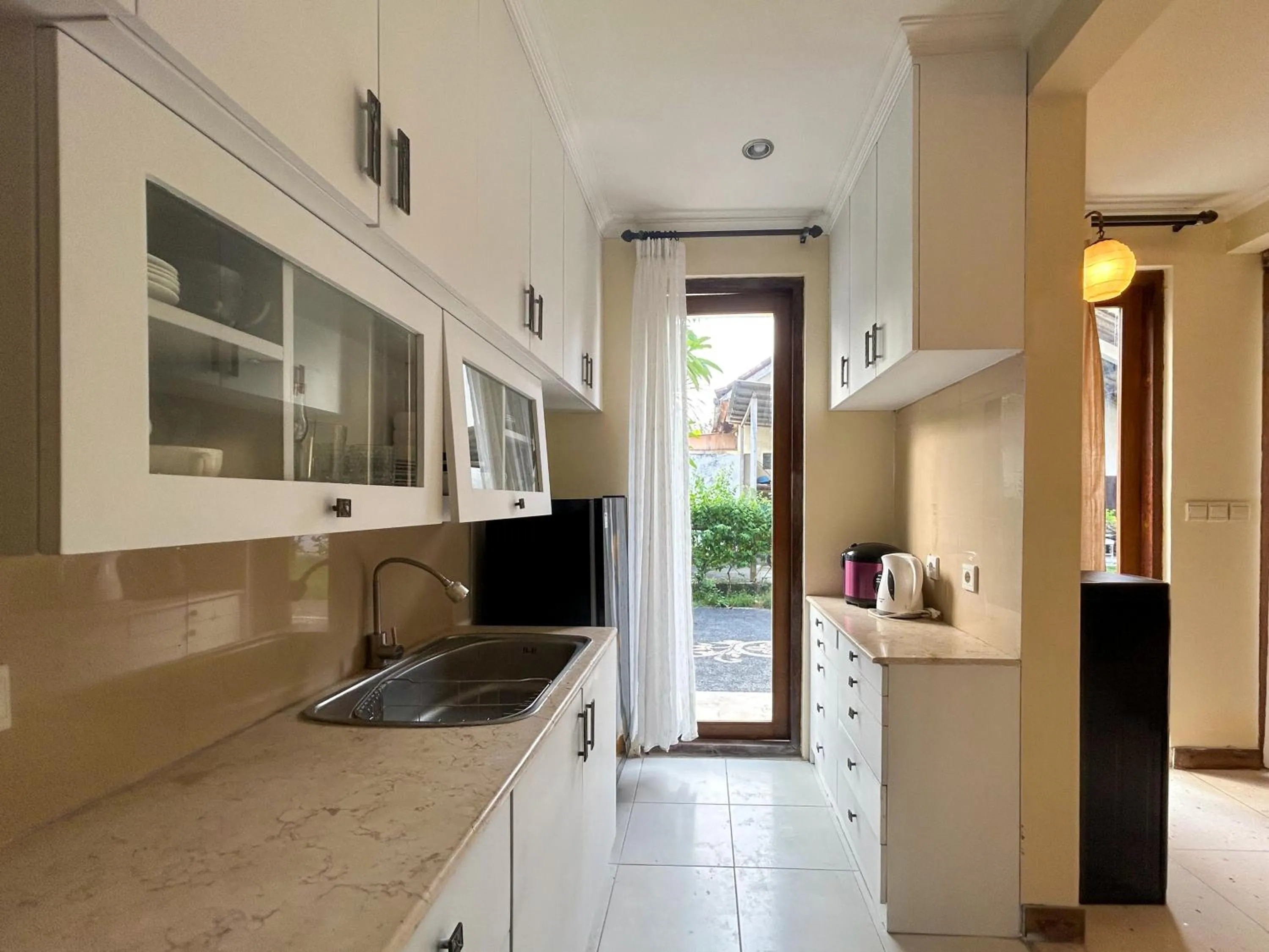 Kitchen or kitchenette in Sayang Taman Villas