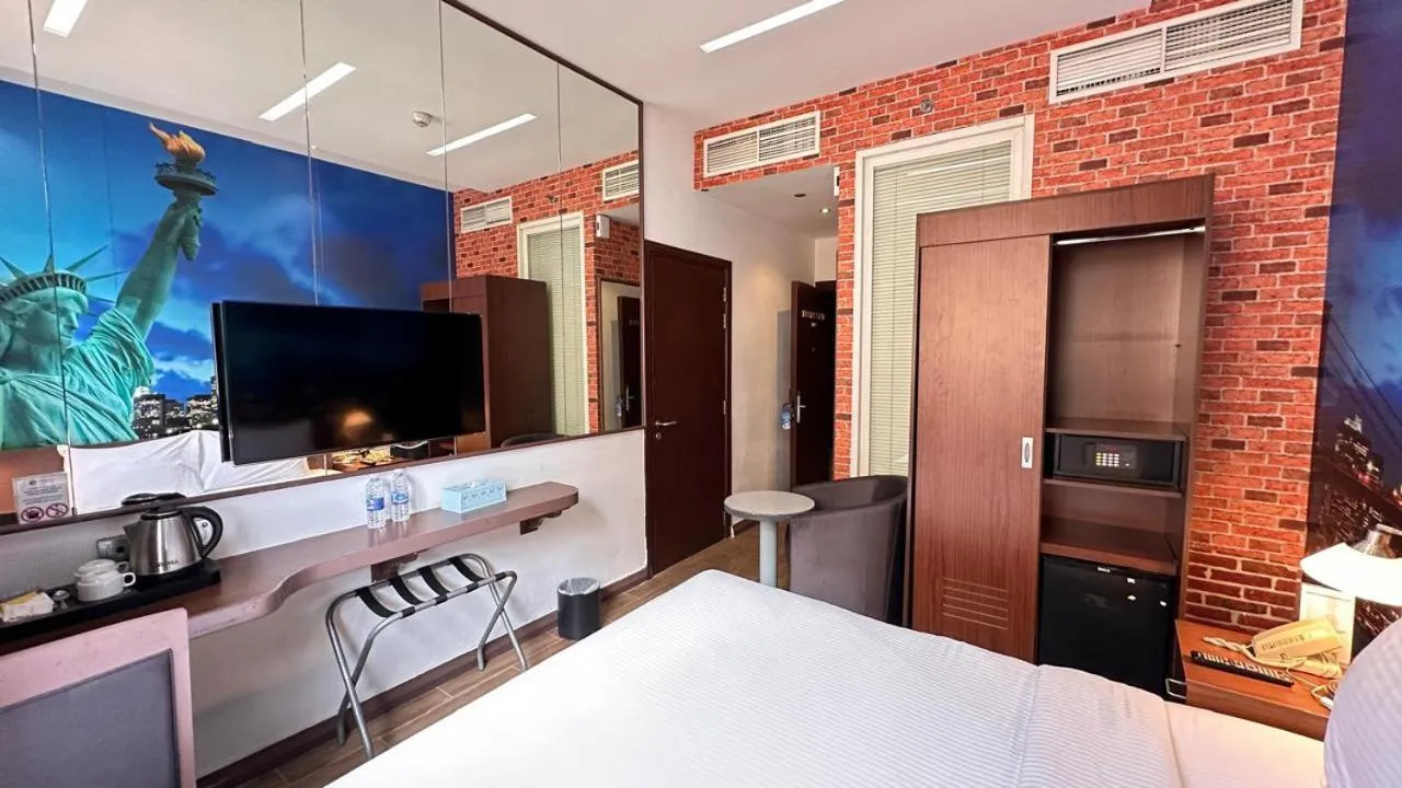 Bed in Reflections Hotel