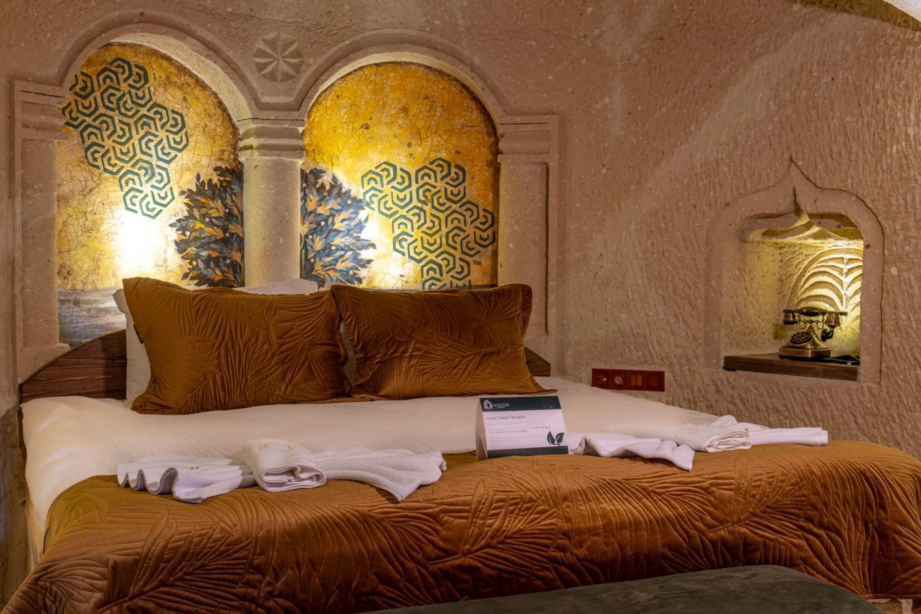 Bed in Lagoon Cave Suites