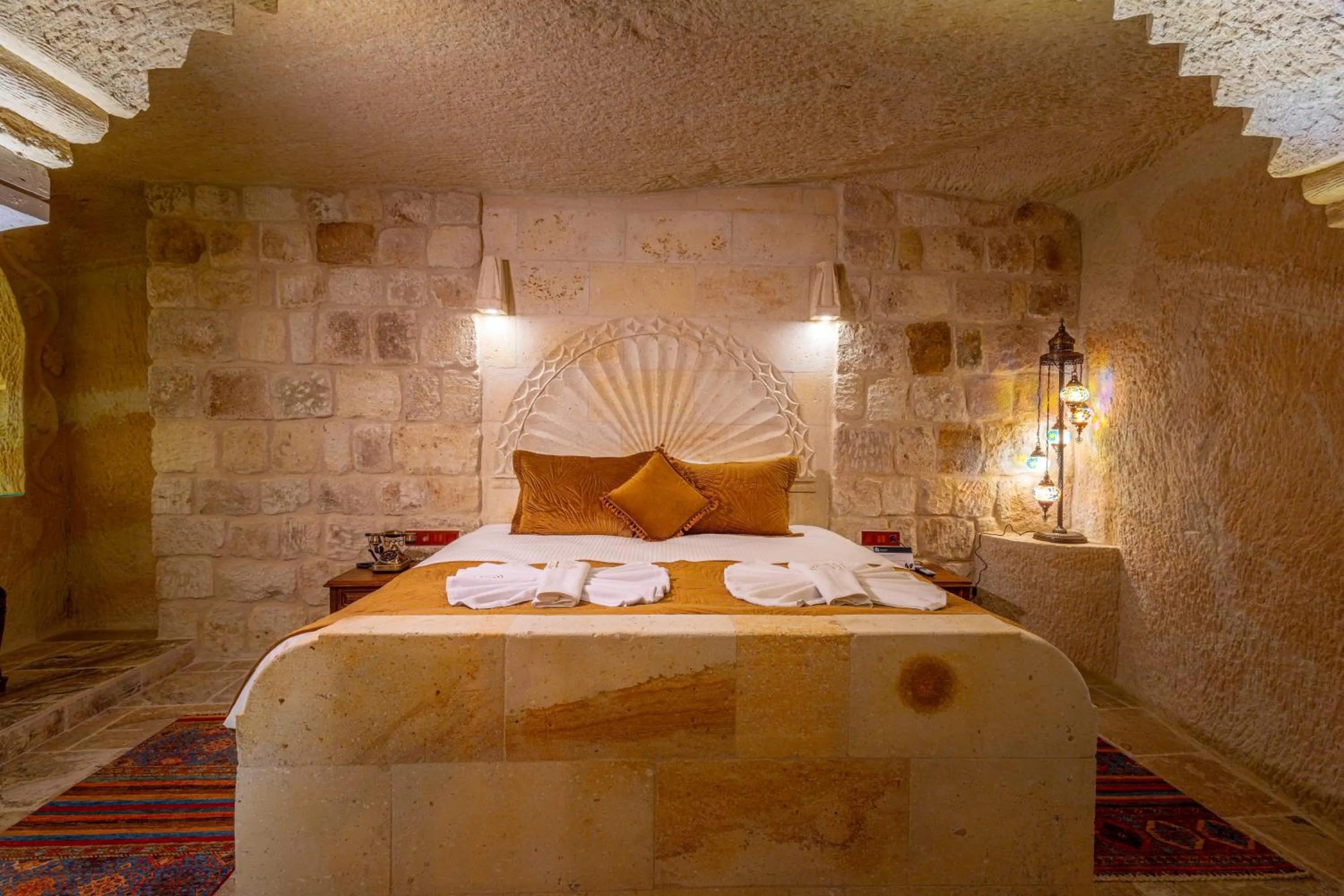 Bed in Lagoon Cave Suites