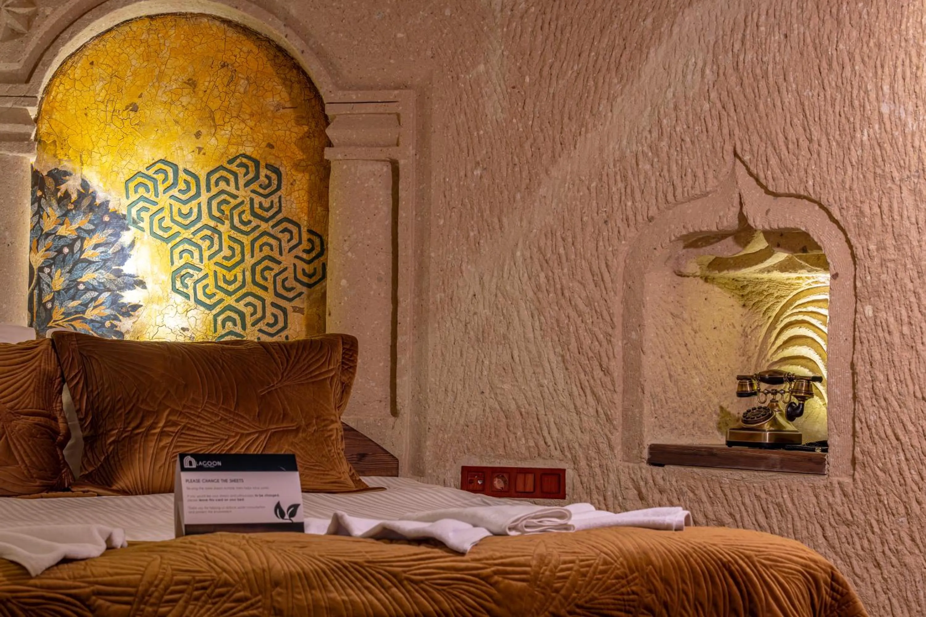 Bed in Lagoon Cave Suites