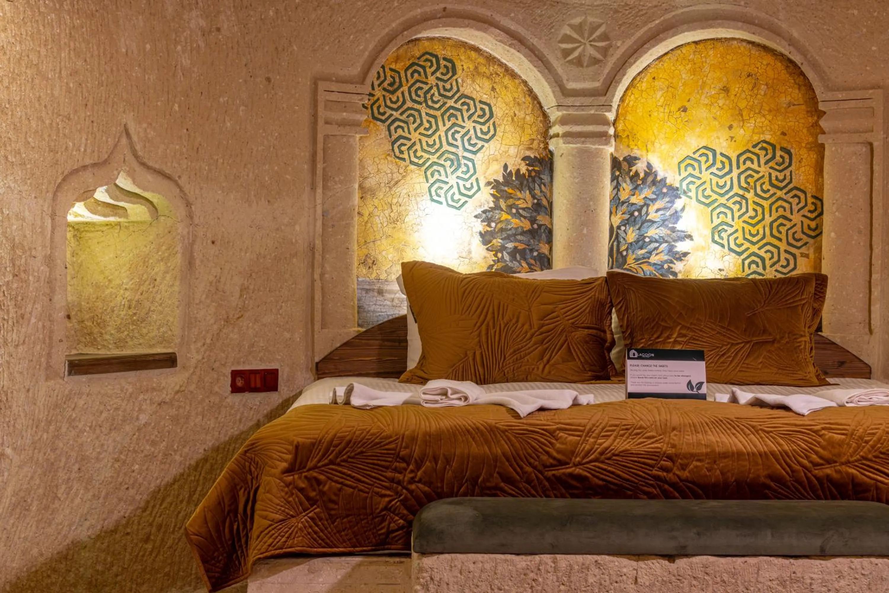 Bed in Lagoon Cave Suites