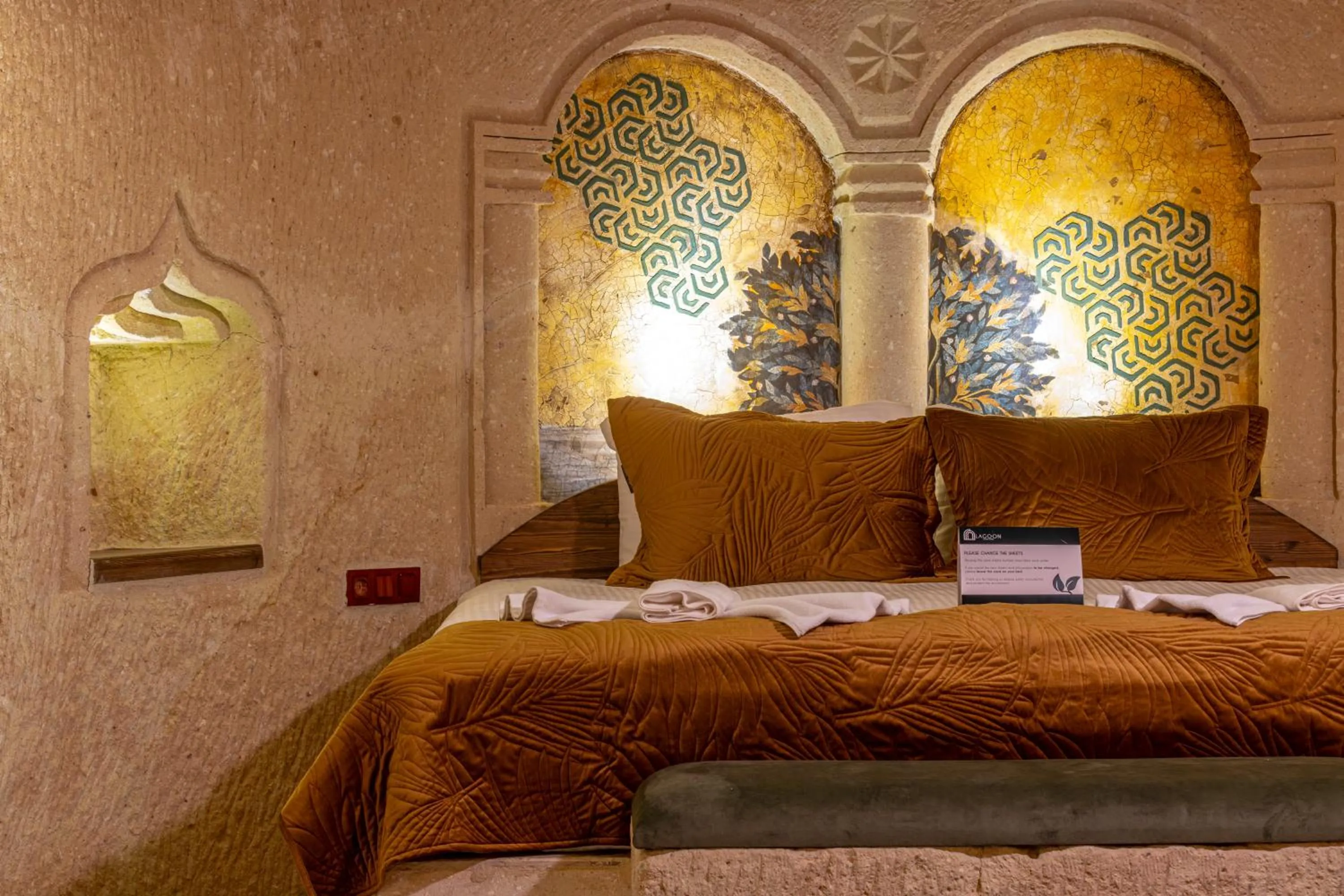 Bed in Lagoon Cave Suites