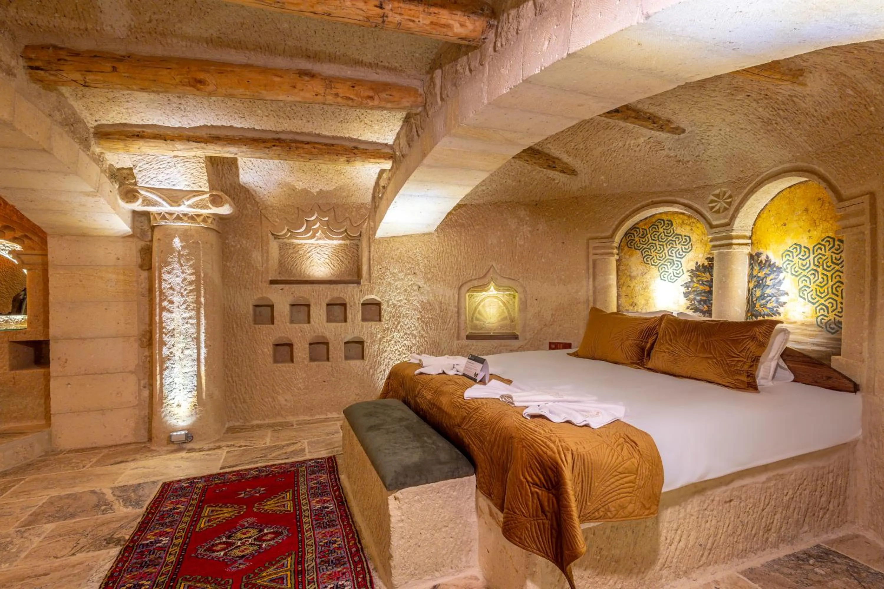 Bed in Lagoon Cave Suites