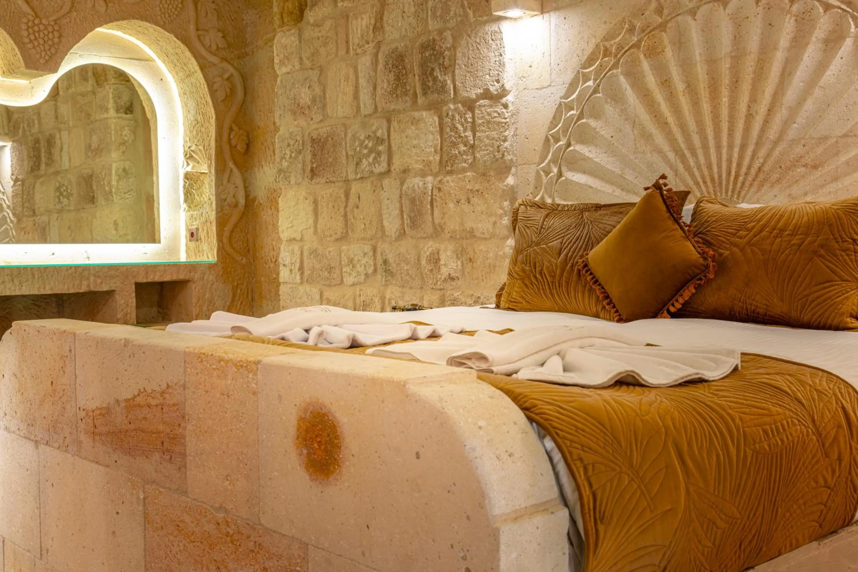 Bed in Lagoon Cave Suites
