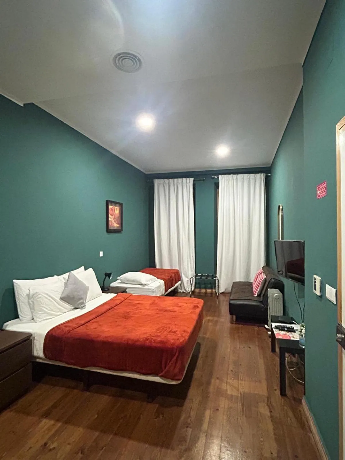 Bed in Sao Jorge Apartments & Suites