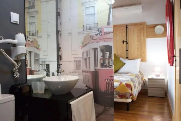 Bed in Sao Jorge Apartments & Suites