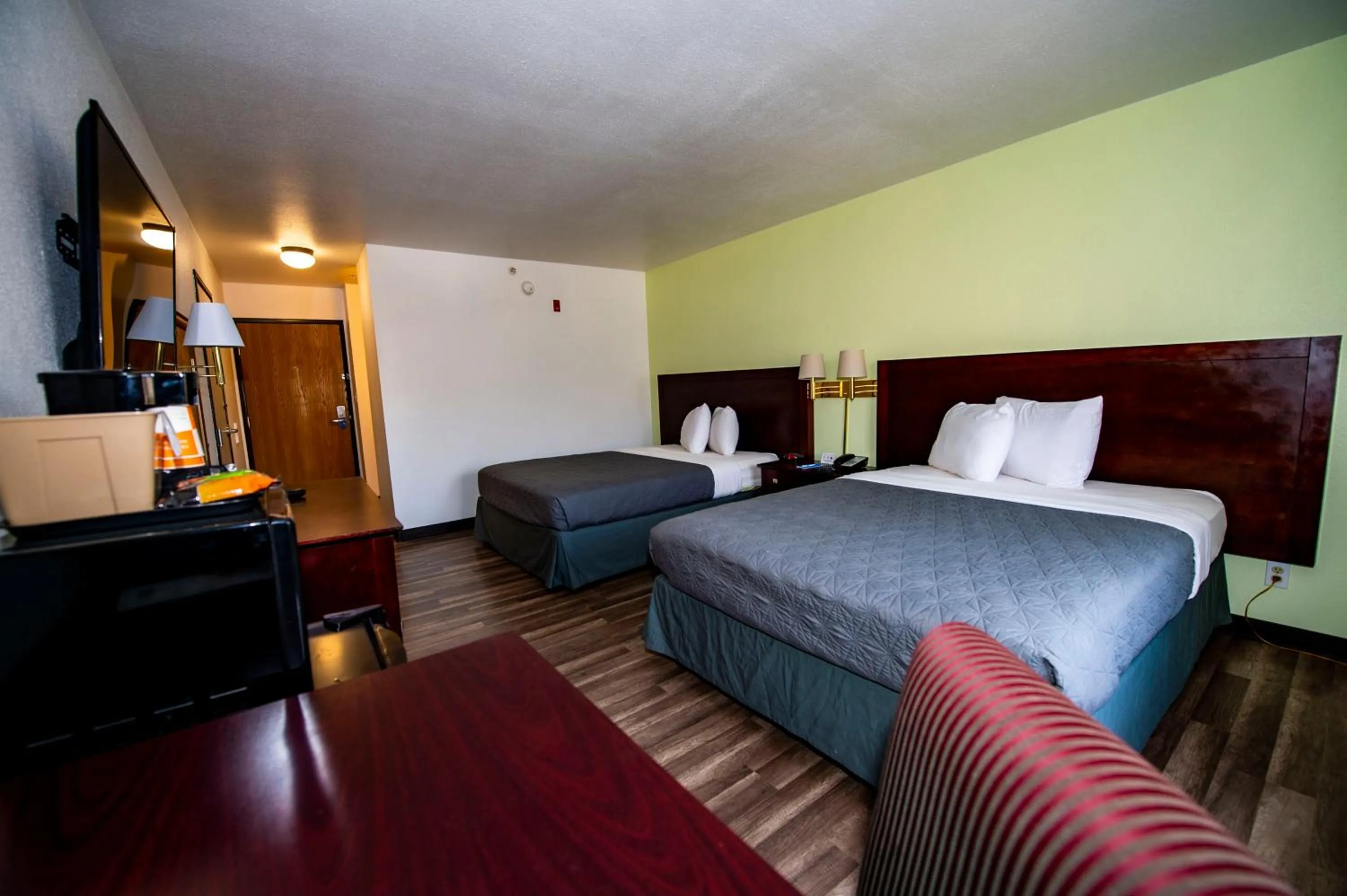Photo of the whole room, Bed in Rodeway Inn Central Colorado Springs