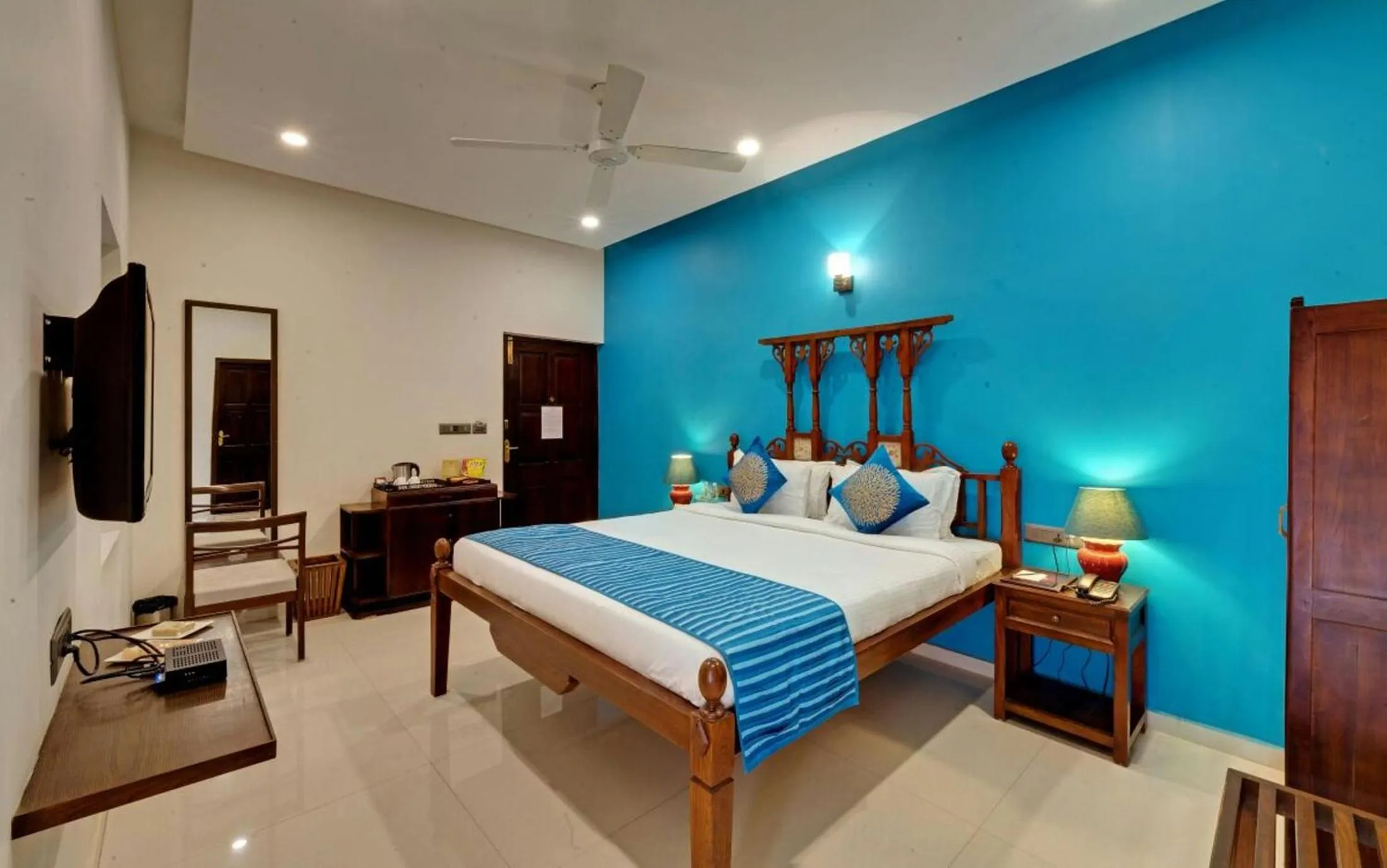 Bed in WelcomHeritage Mani Mansion