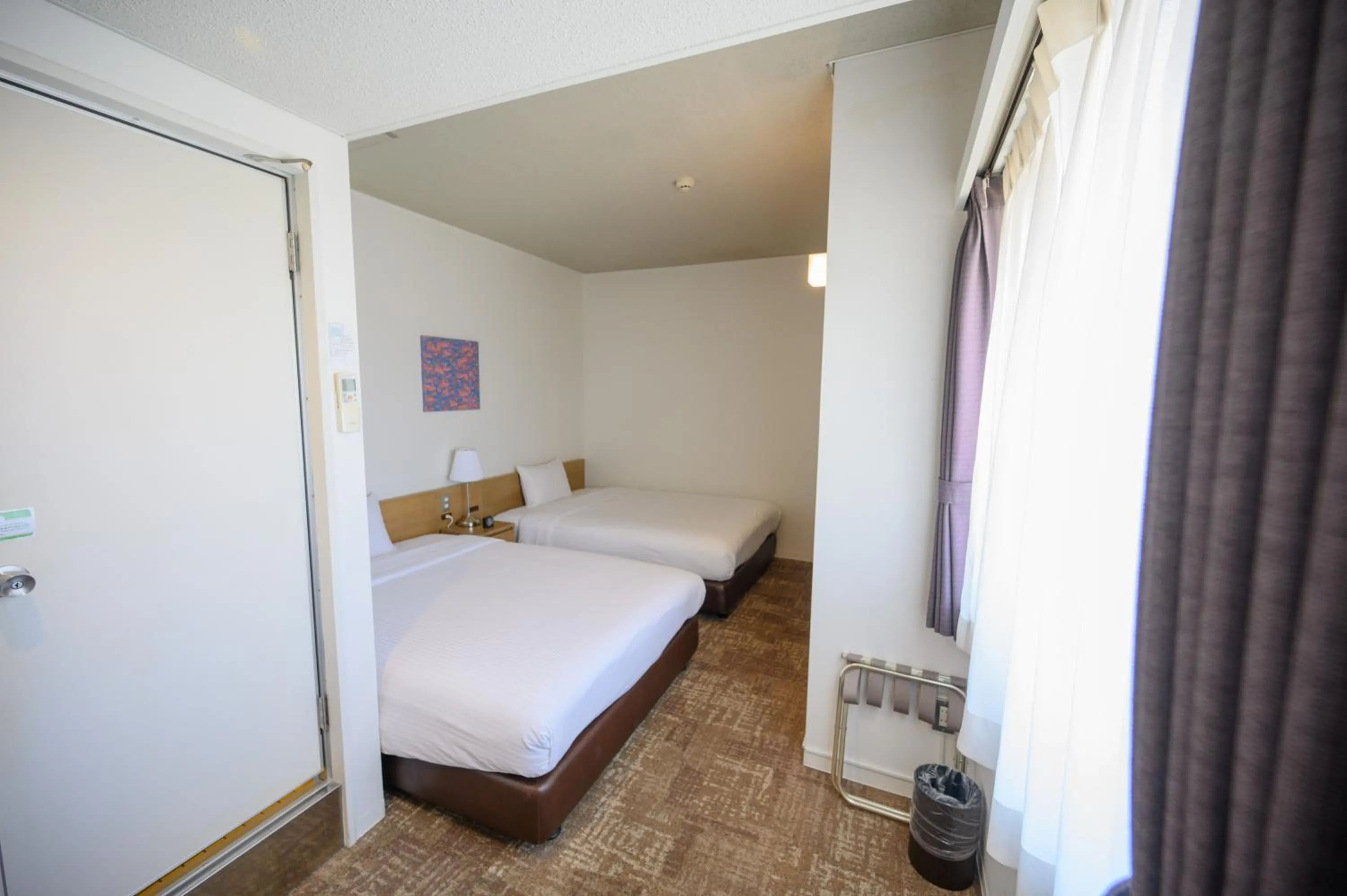 Photo of the whole room, Bed in Hotel Emerald Isle Ishigakijima