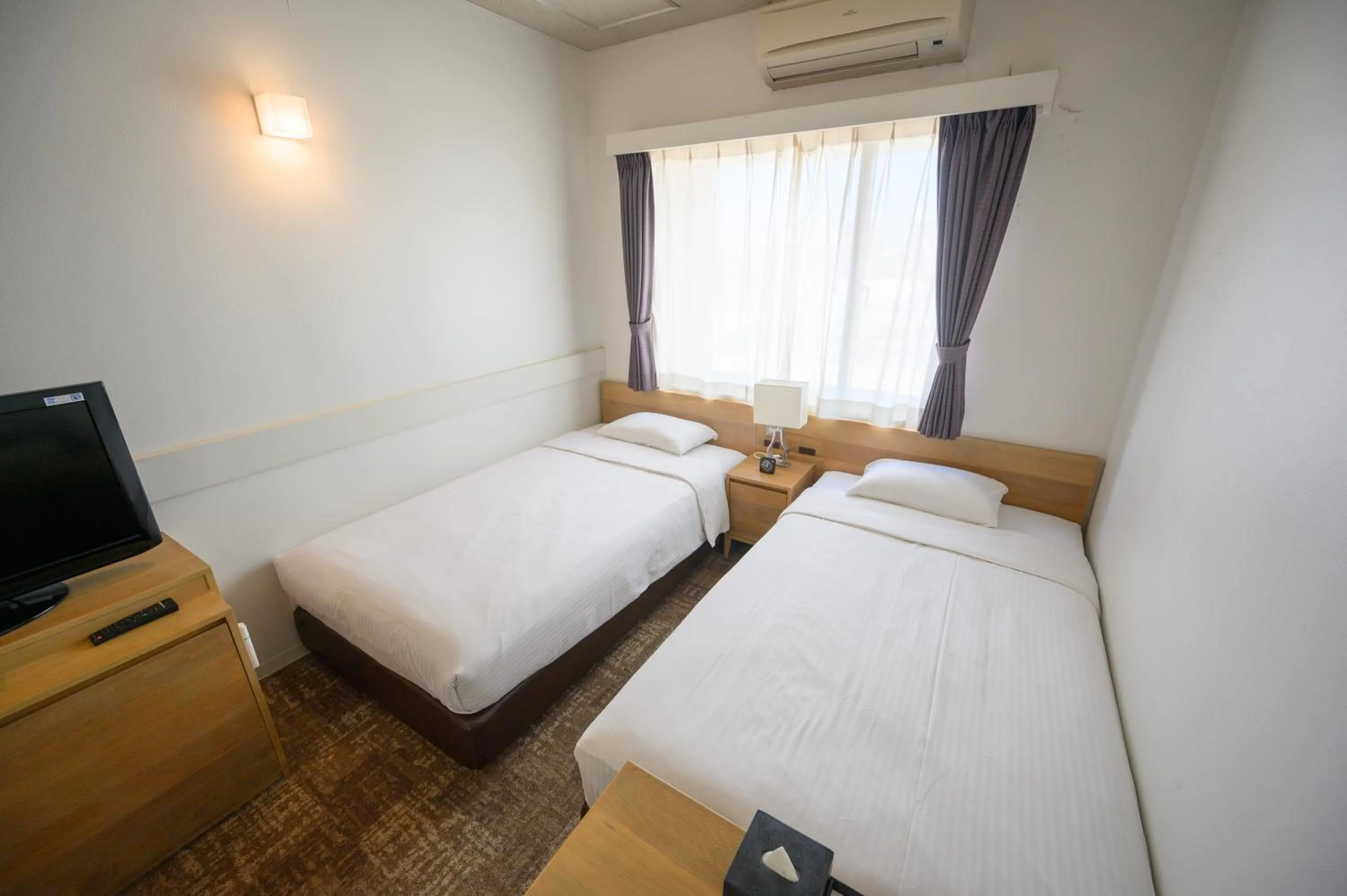 Photo of the whole room, Bed in Hotel Emerald Isle Ishigakijima